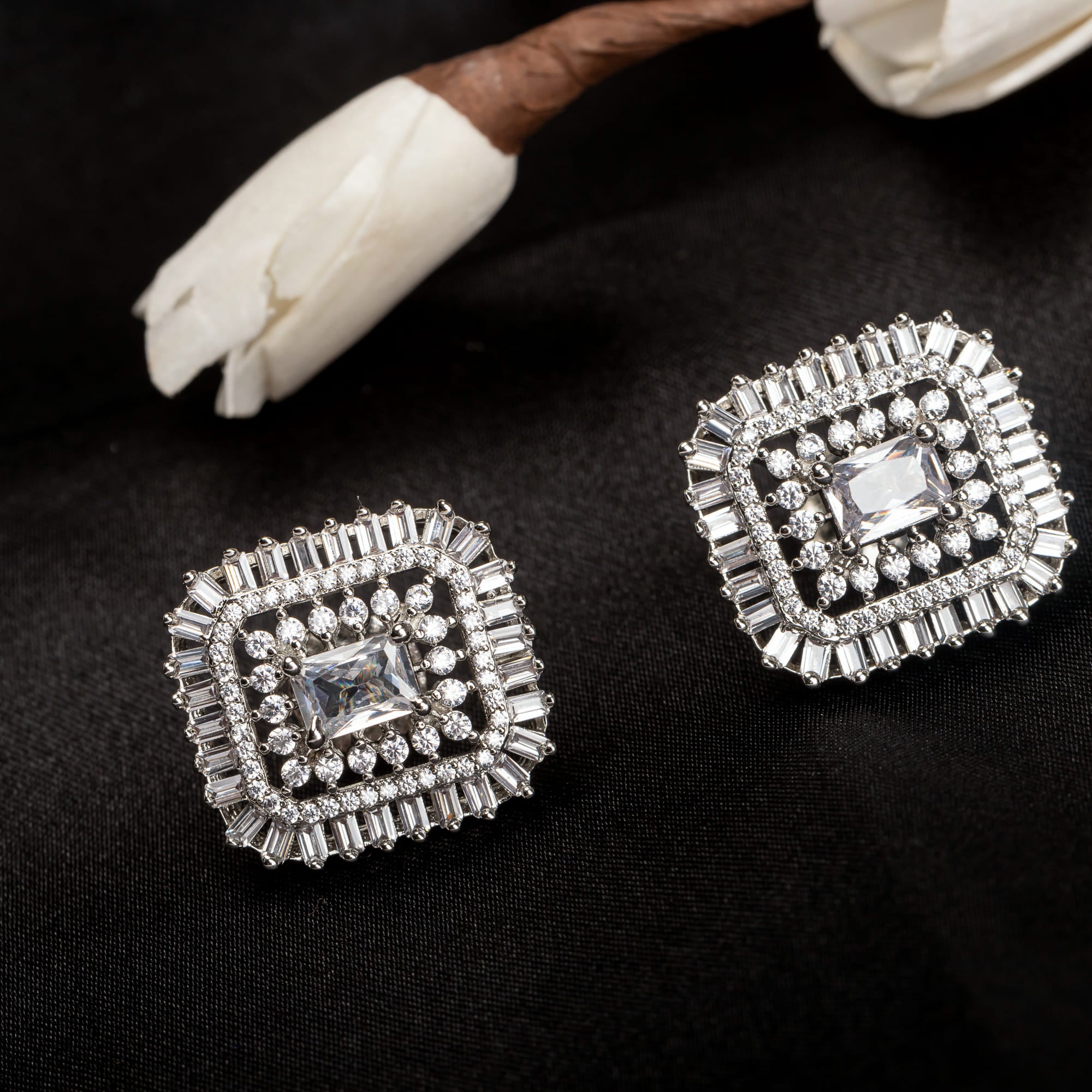 Square zircon stud earrings provide sleek, modern sparkle.