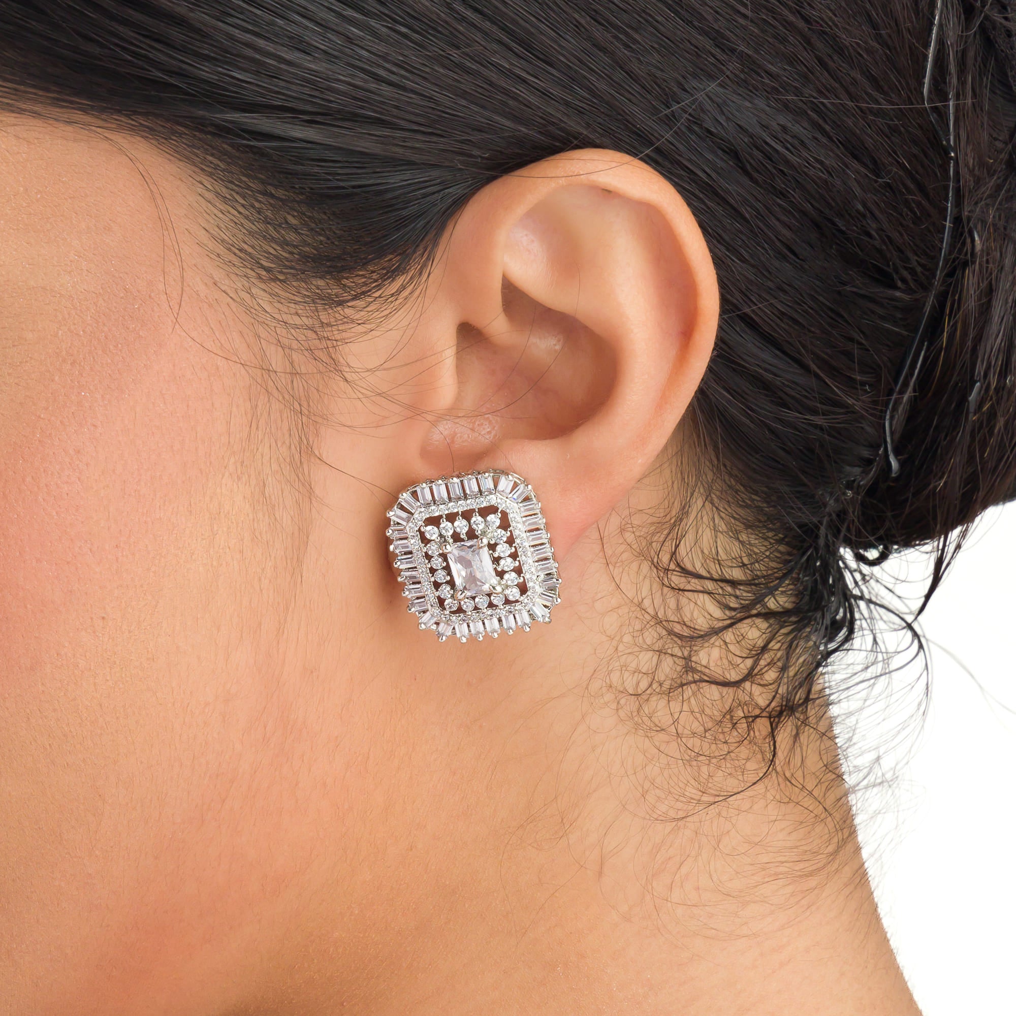 Square zircon stud earrings provide sleek, modern sparkle.