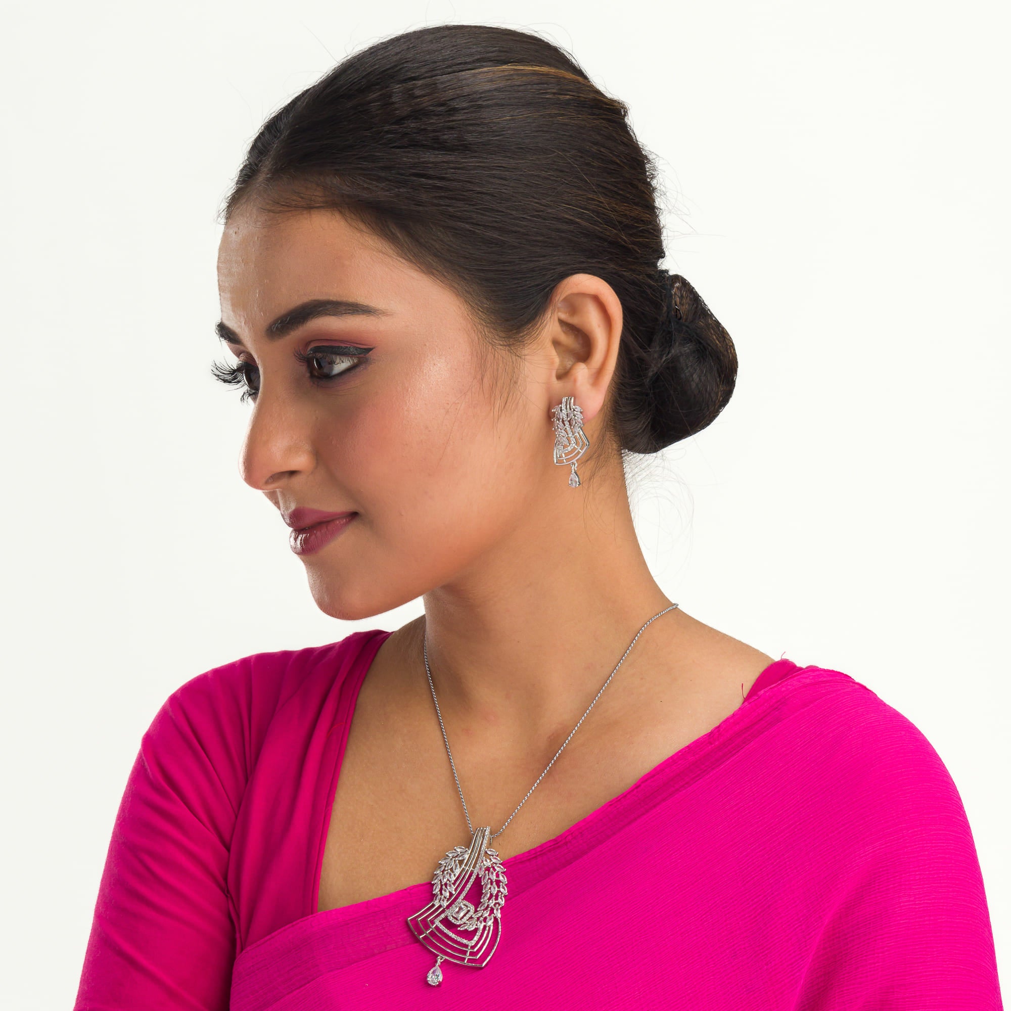 Silver zircon pendant shines with refined elegance for a timeless look.