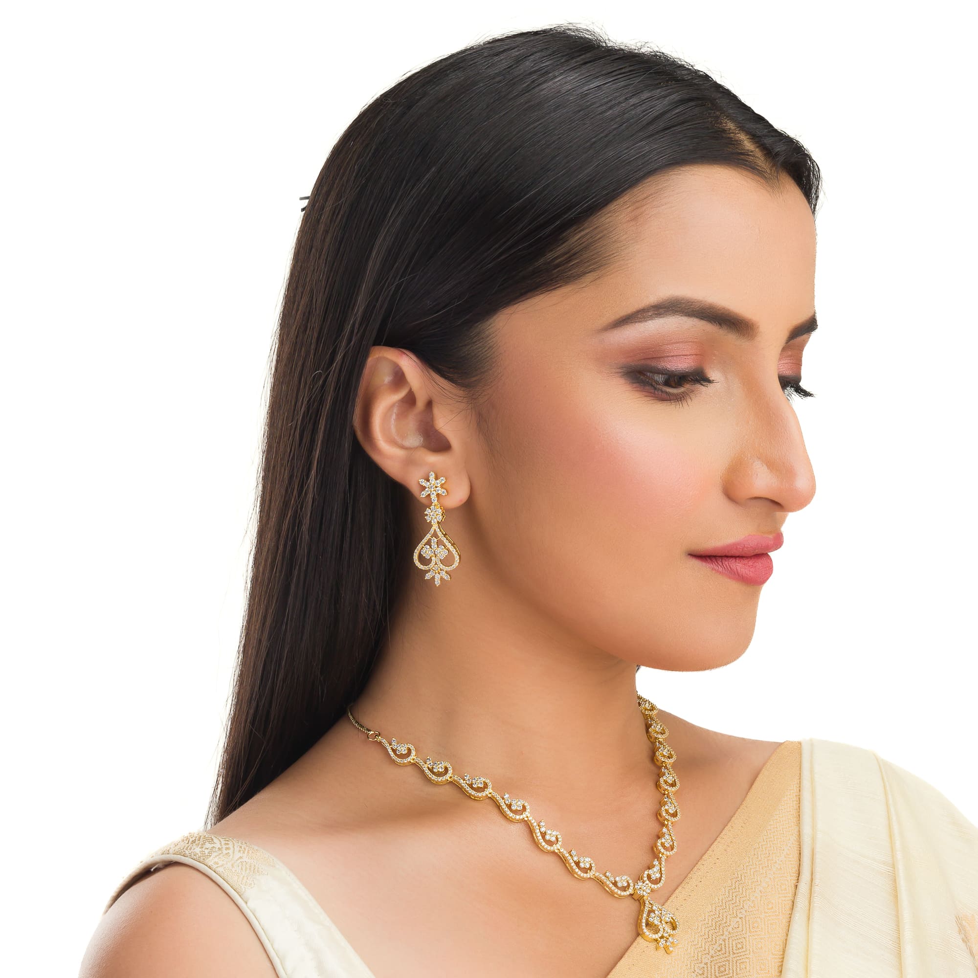 Small S-shaped zircon necklace with gold polish offers delicate elegance and subtle sparkle.