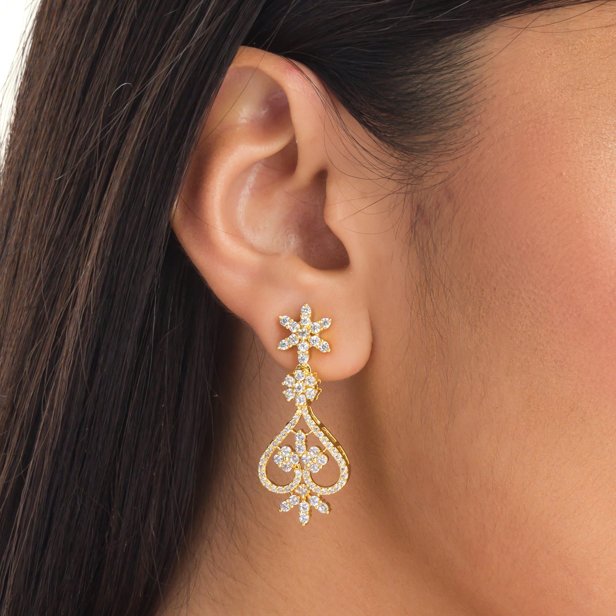 Small S-shaped zircon necklace with gold polish offers delicate elegance and subtle sparkle.