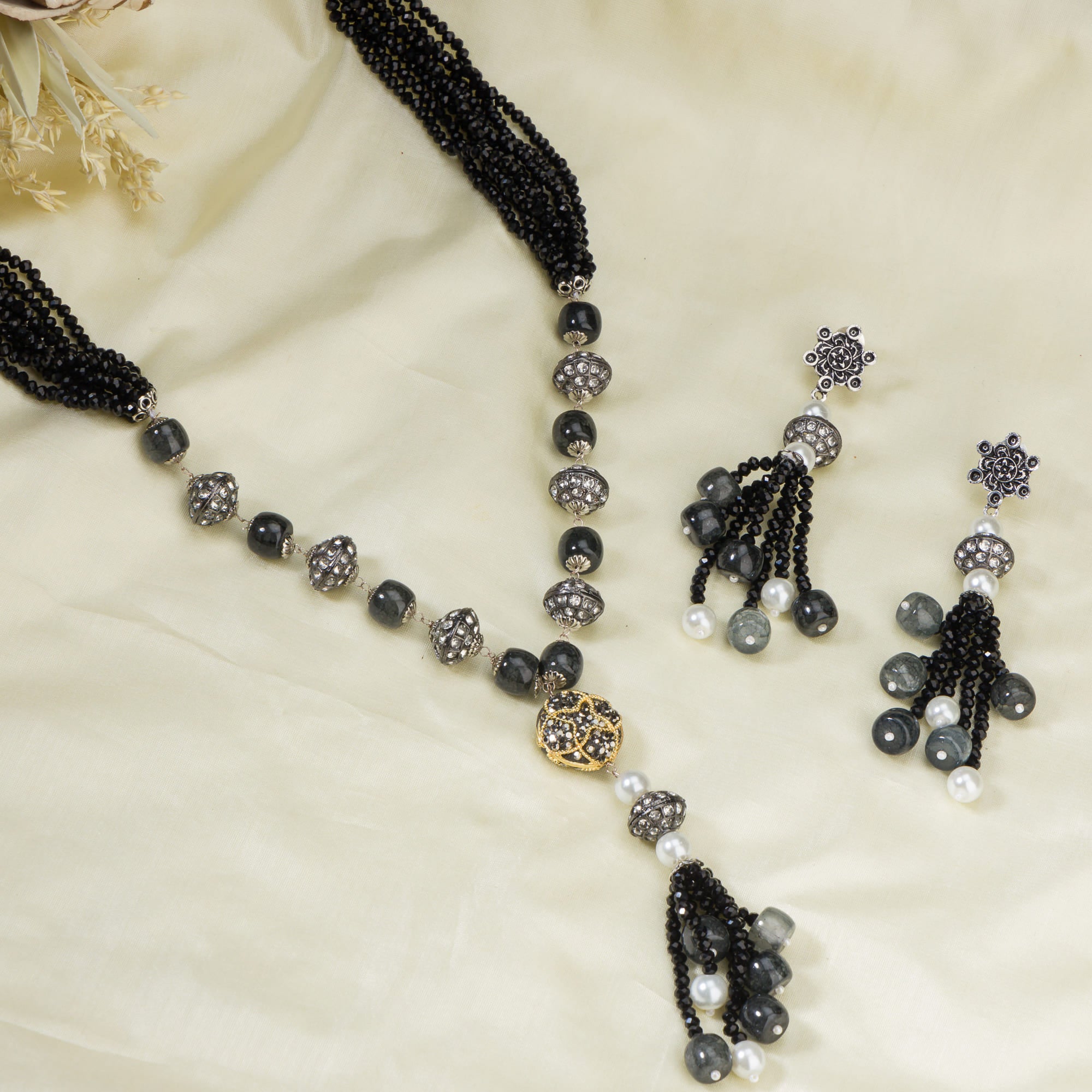"Sophisticated black pearl long necklace set exudes elegant charm."