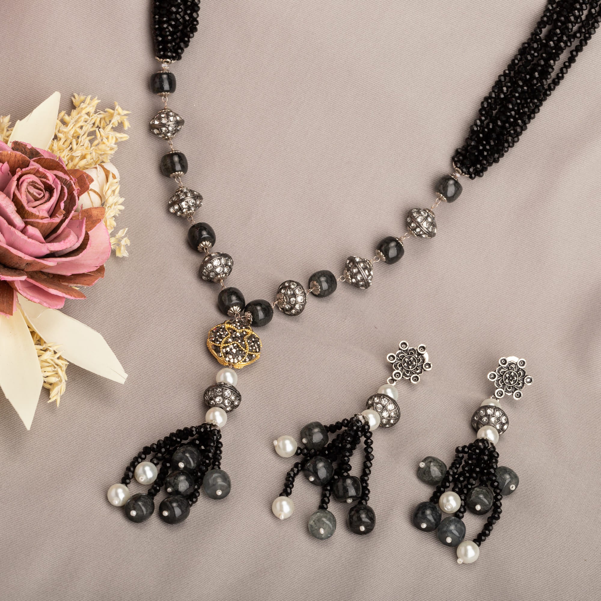 "Sophisticated black pearl long necklace set exudes elegant charm."