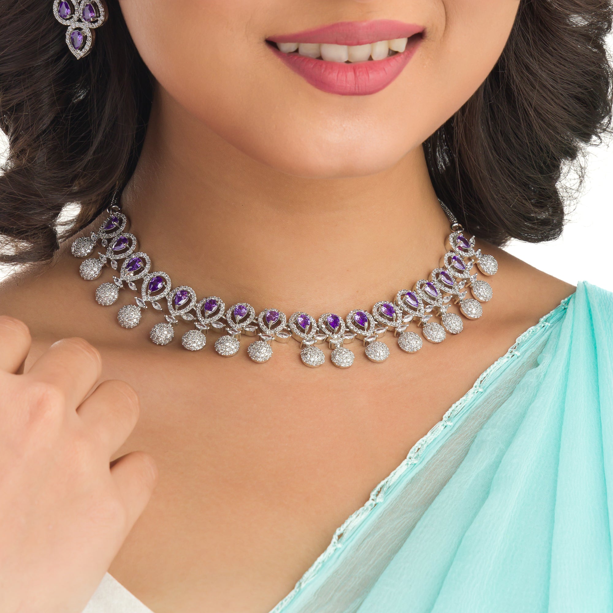 Violet zircon necklace adds a rich, sophisticated touch to festive looks.
