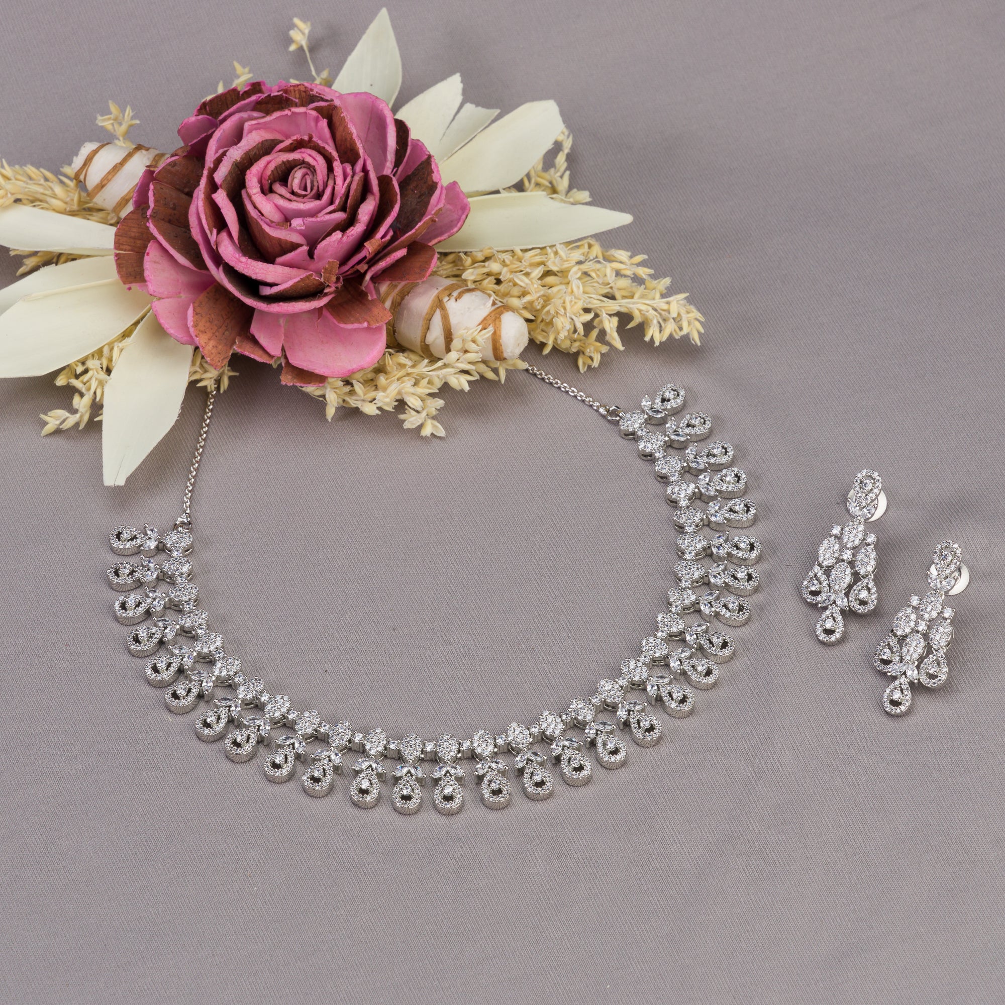 Elegant zircon necklace in silver polish offers rich, sophisticated charm.