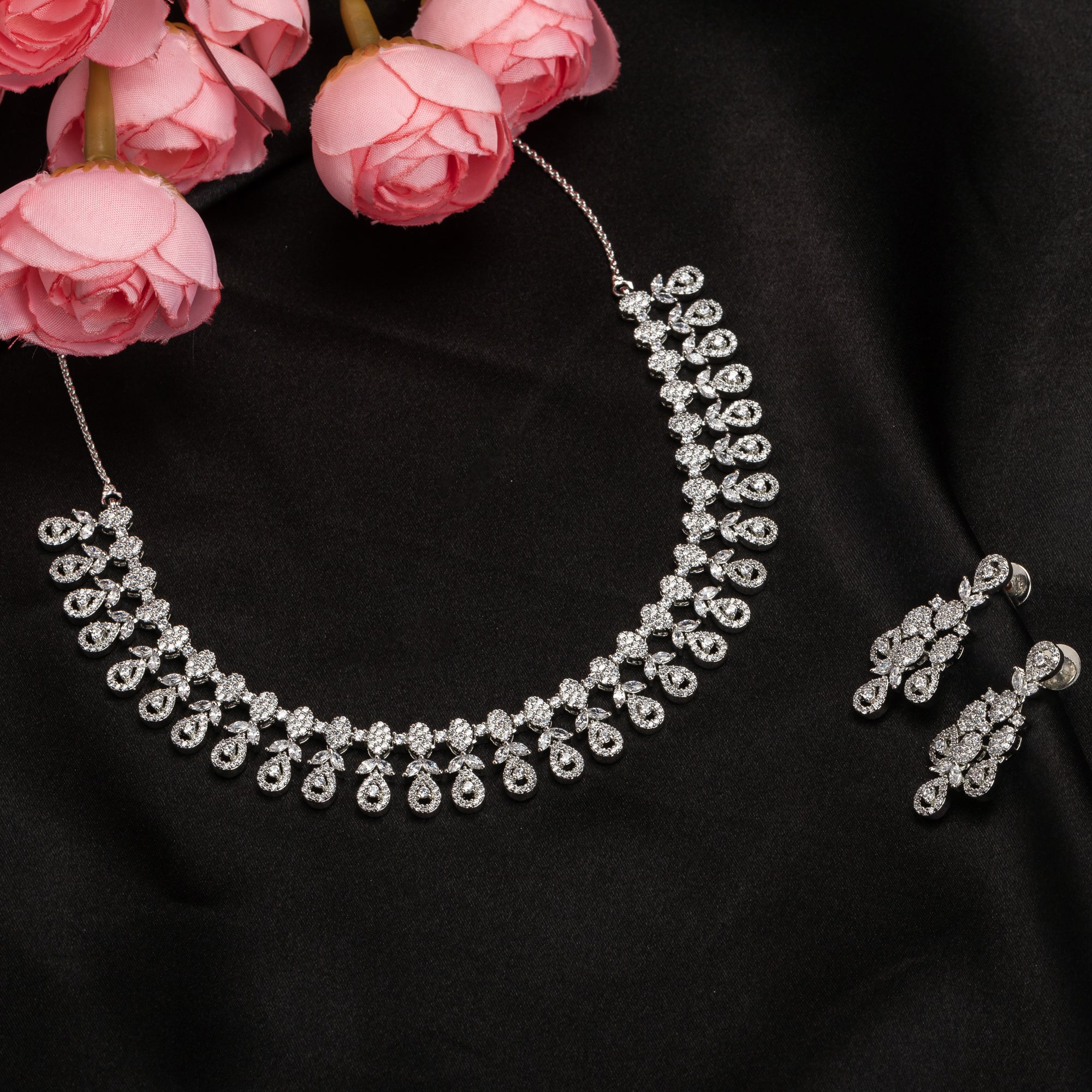 Elegant zircon necklace in silver polish offers rich, sophisticated charm.
