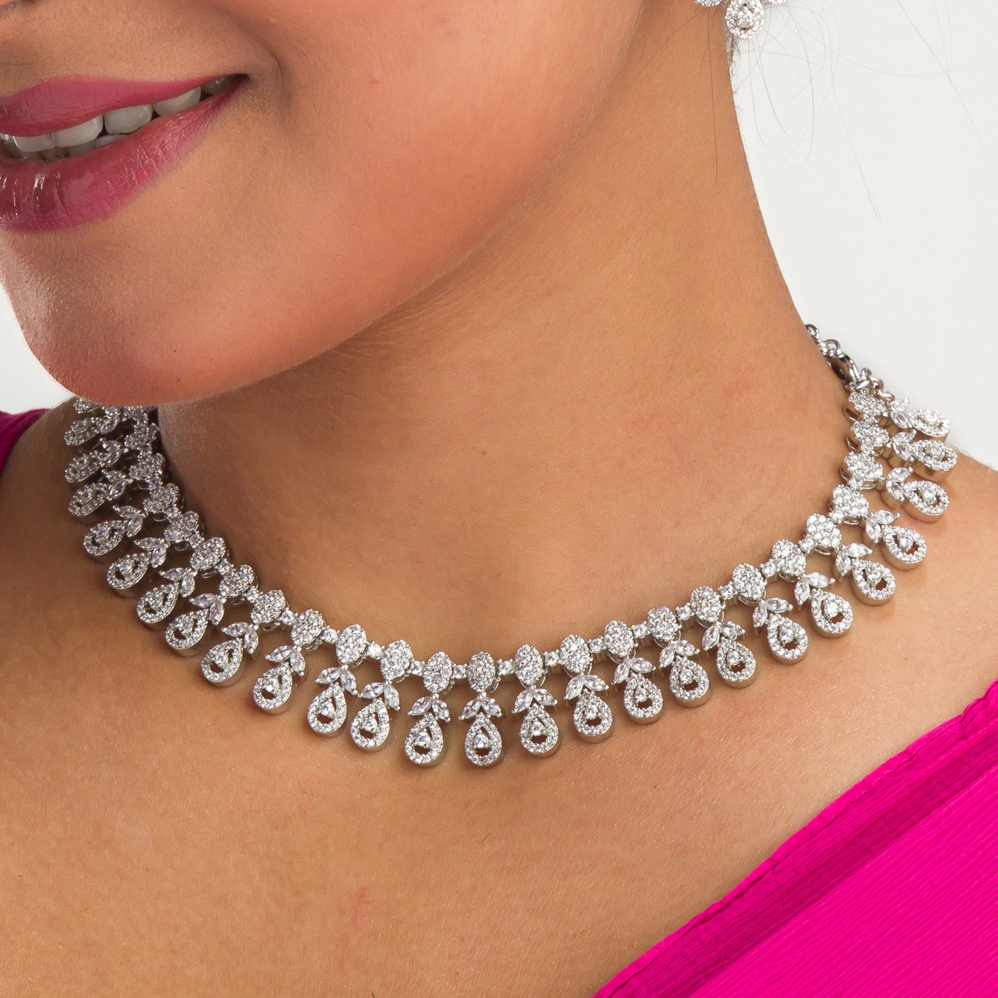 Elegant zircon necklace in silver polish offers rich, sophisticated charm.
