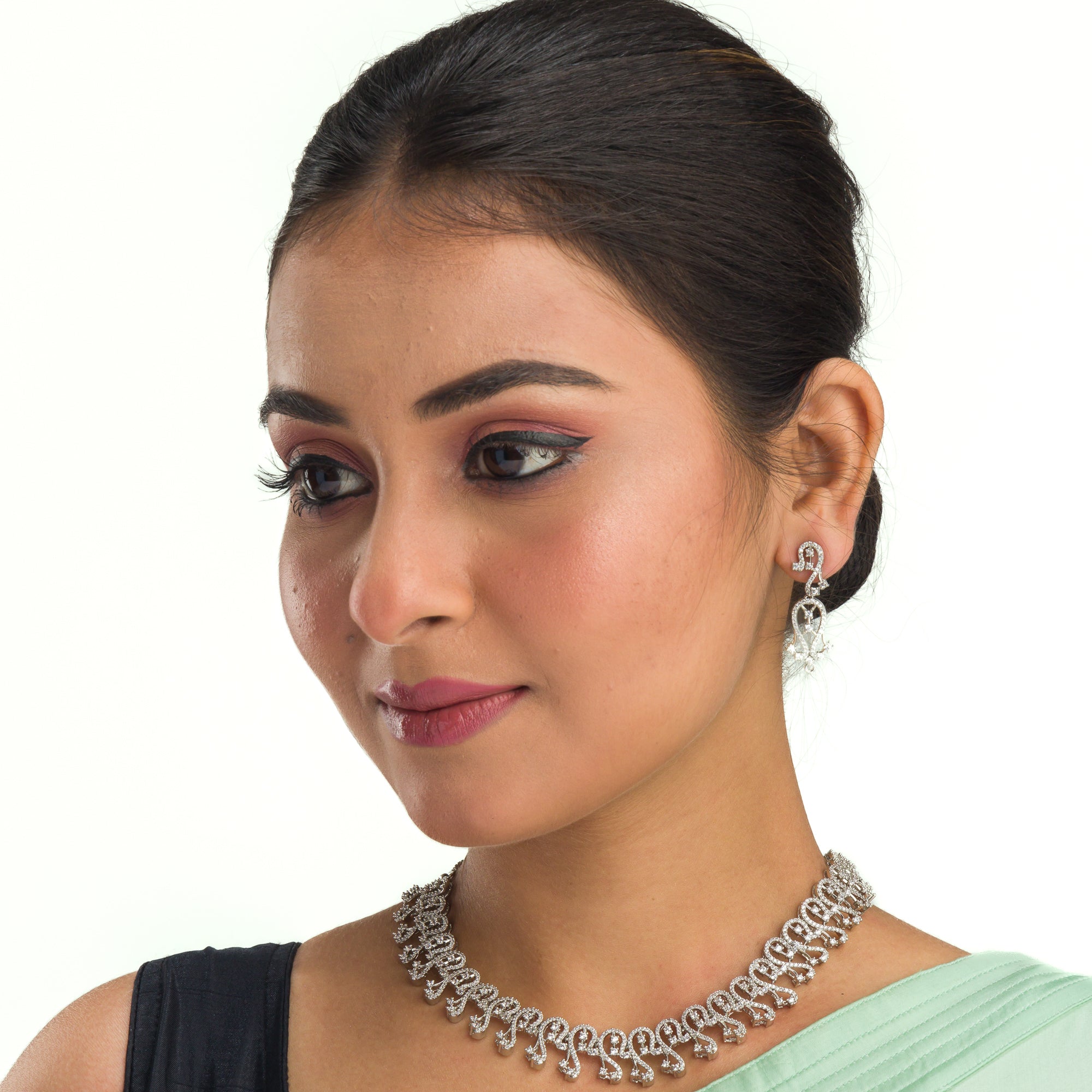 S-shaped zircon design offers sleek, flowing elegance for a refined style.