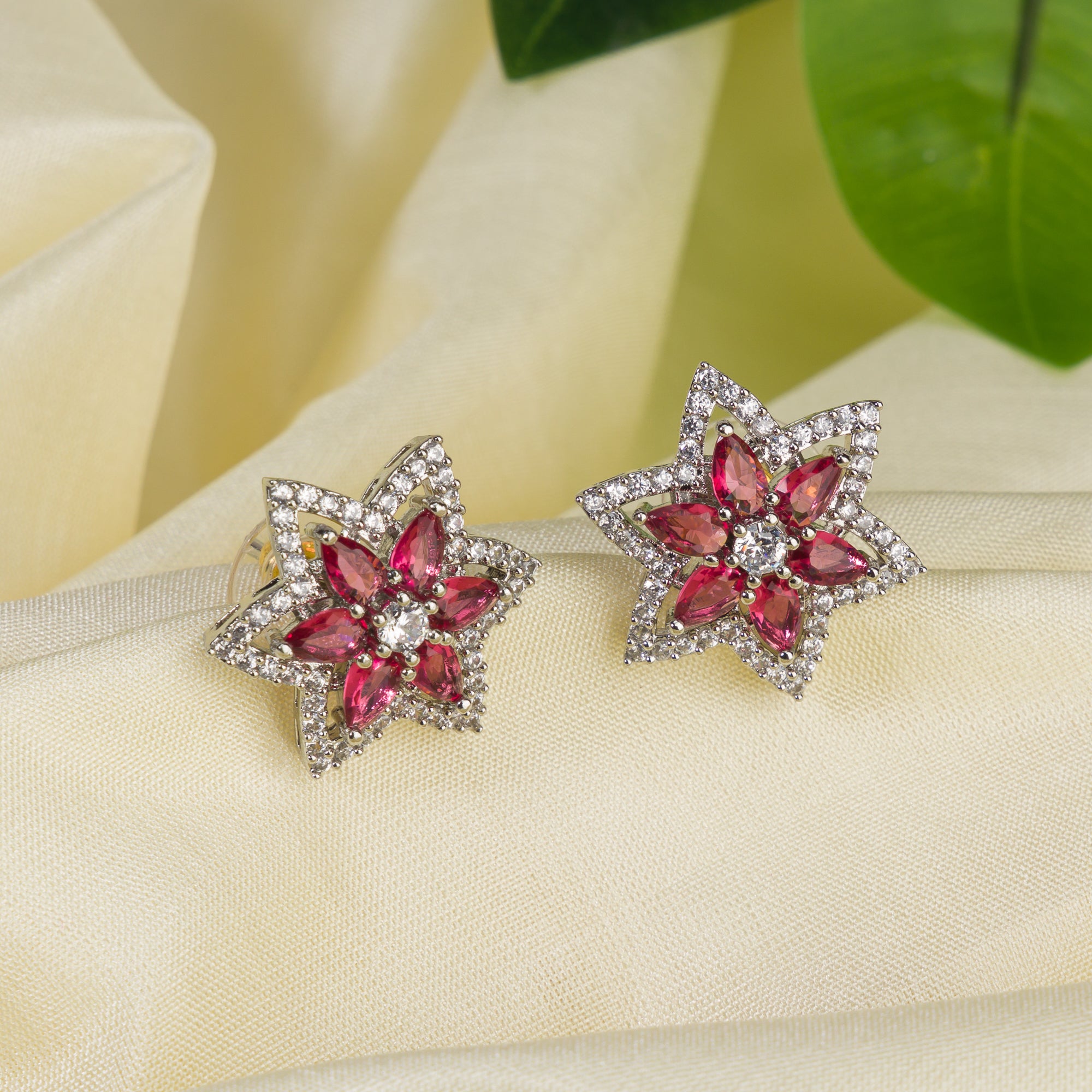 Trendy star-shaped pink zircon studs bring a modern, playful sparkle to your look.