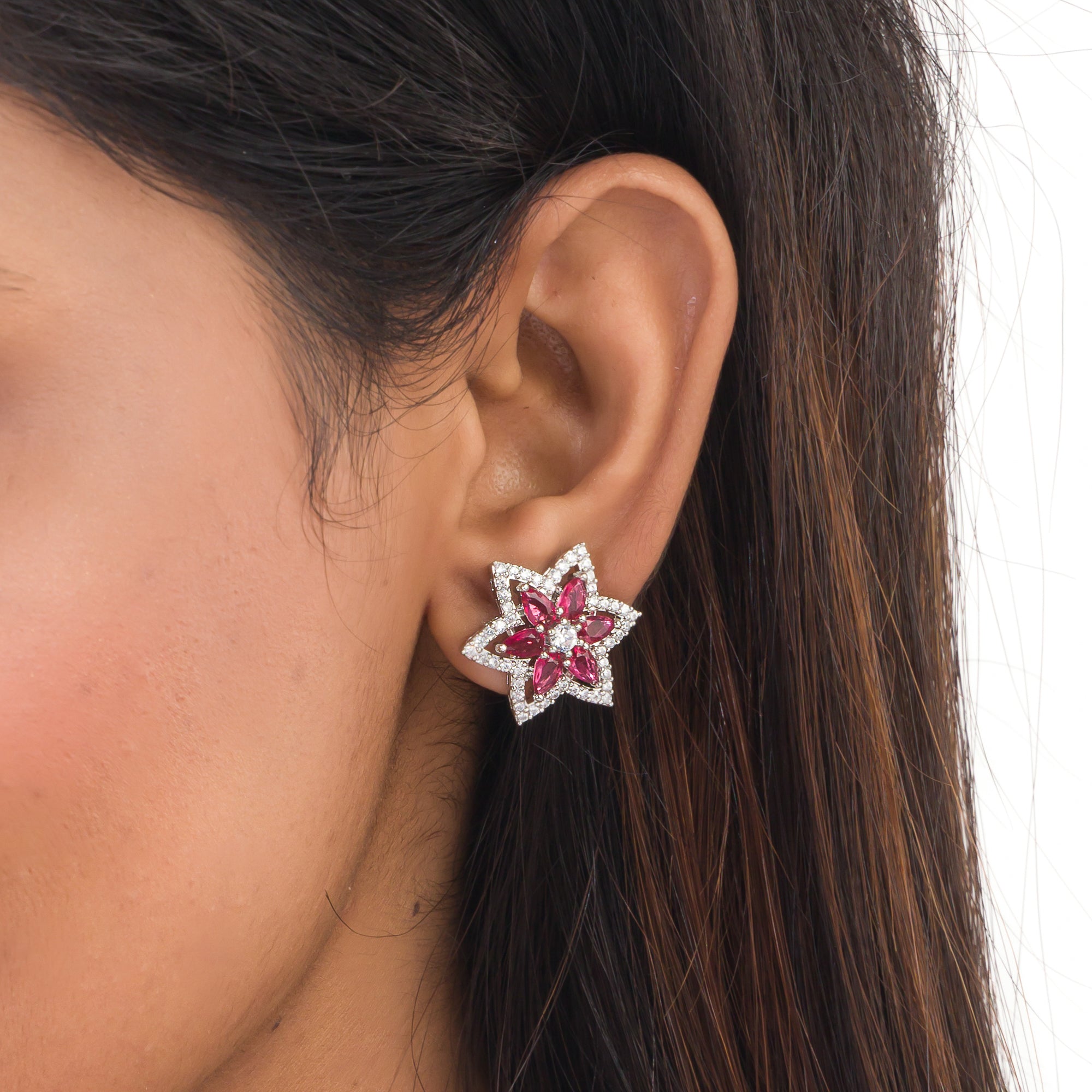 Trendy star-shaped pink zircon studs bring a modern, playful sparkle to your look.