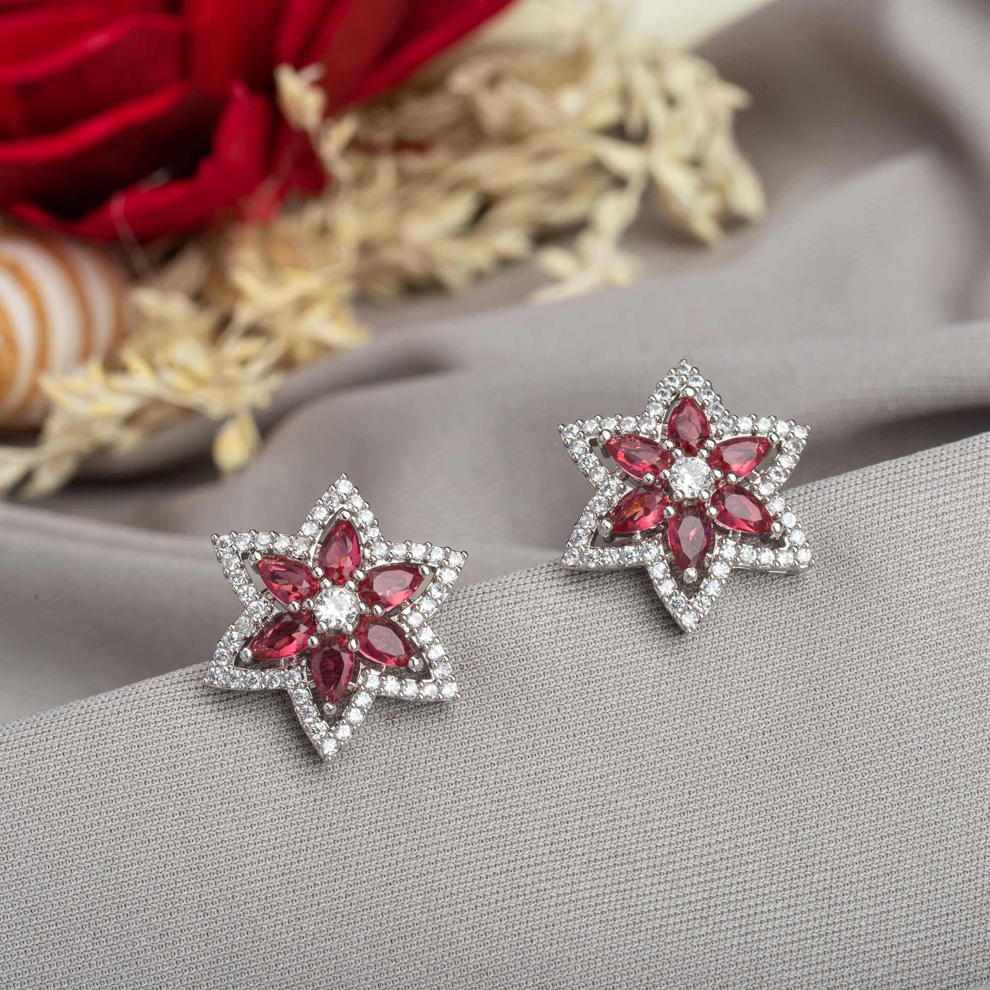 Trendy star-shaped pink zircon studs bring a modern, playful sparkle to your look.