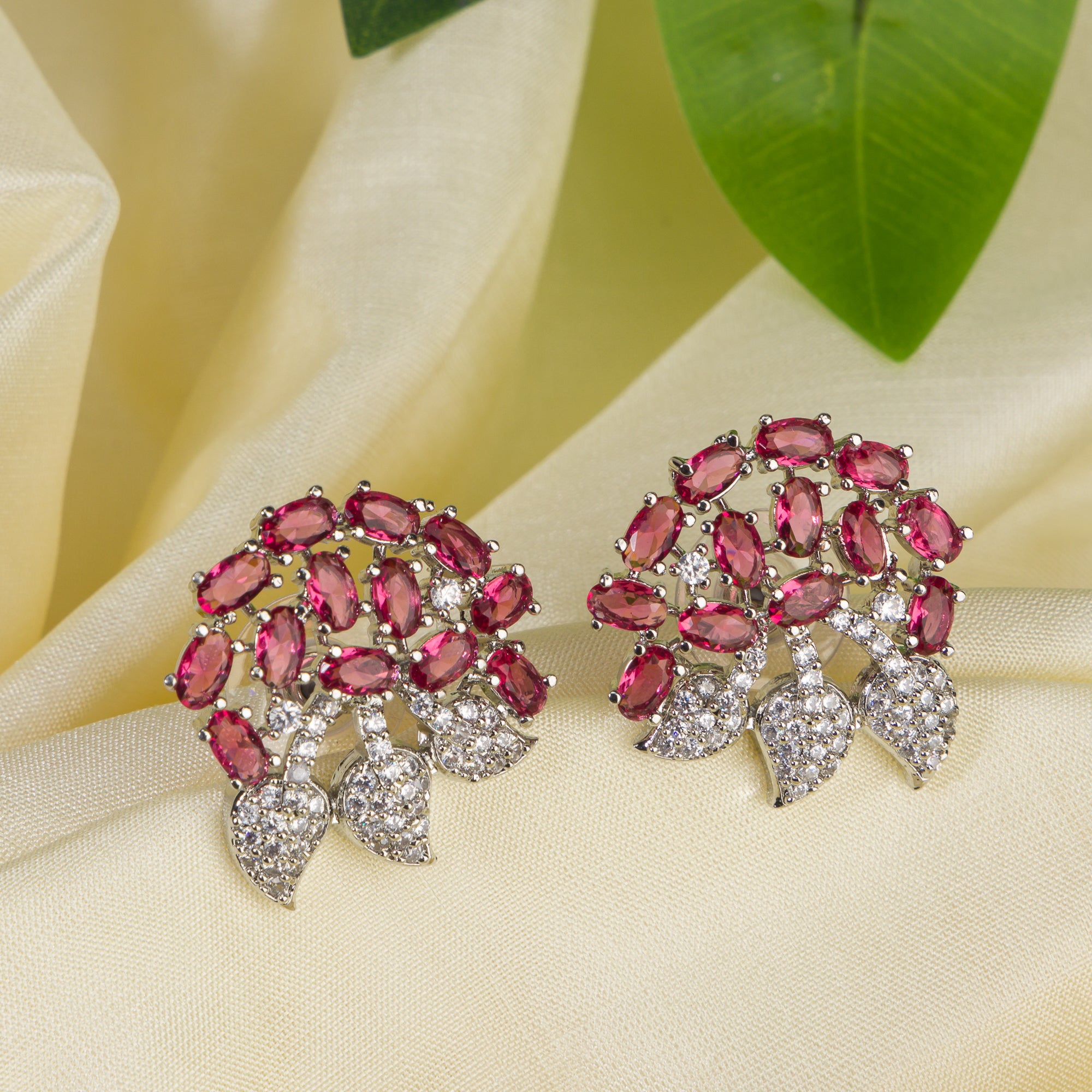 Pink zircon stud earrings exude bold elegance and sparkling charm.