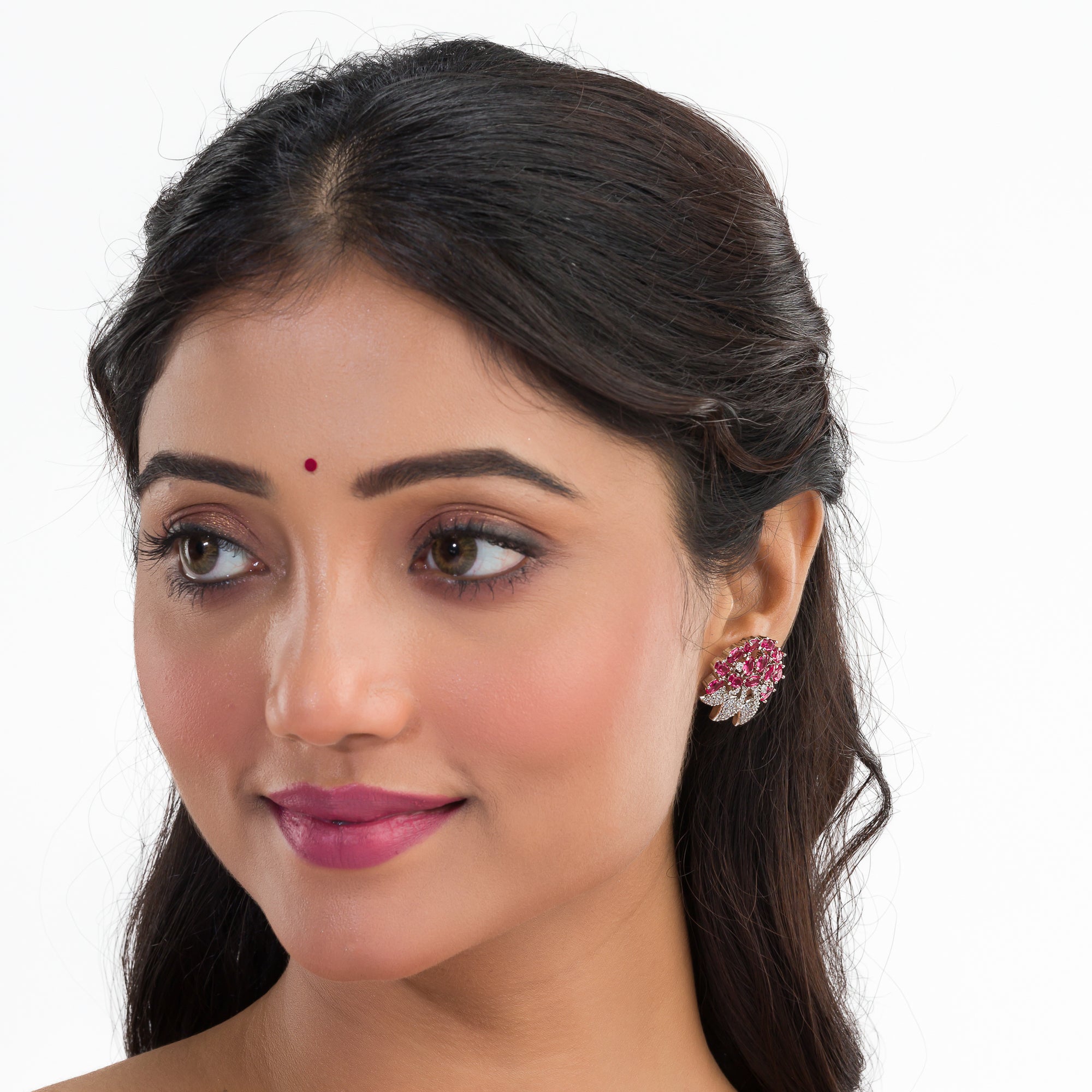 Pink zircon stud earrings exude bold elegance and sparkling charm.