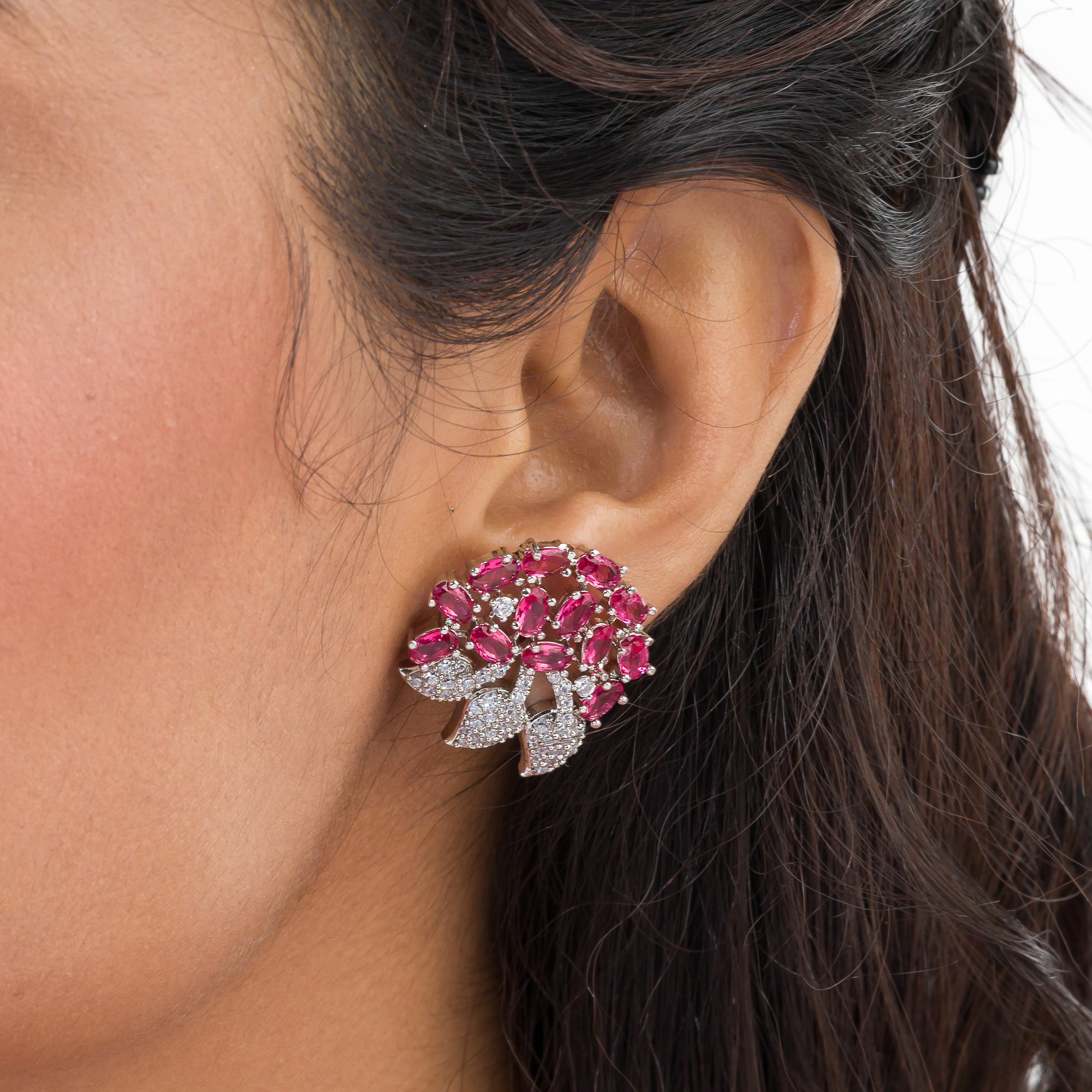 Pink zircon stud earrings exude bold elegance and sparkling charm.