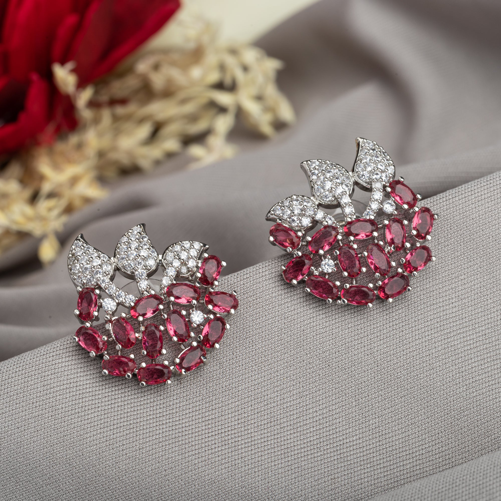 Pink zircon stud earrings exude bold elegance and sparkling charm.