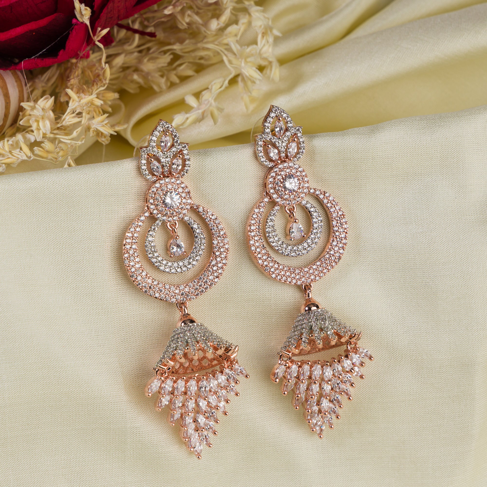 Sparkling zircon dangler earrings in rose gold, perfect for party elegance.