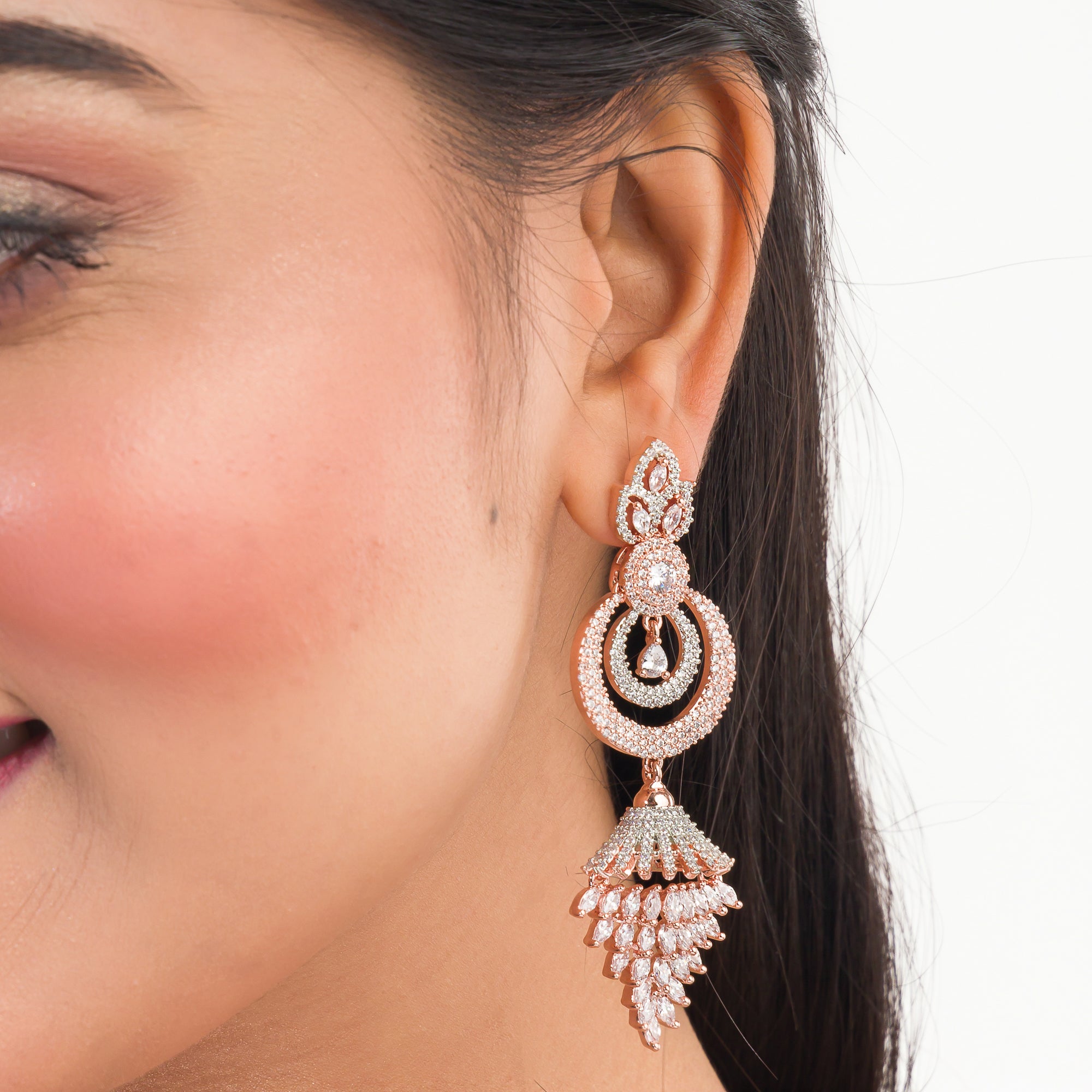 Sparkling zircon dangler earrings in rose gold, perfect for party elegance.