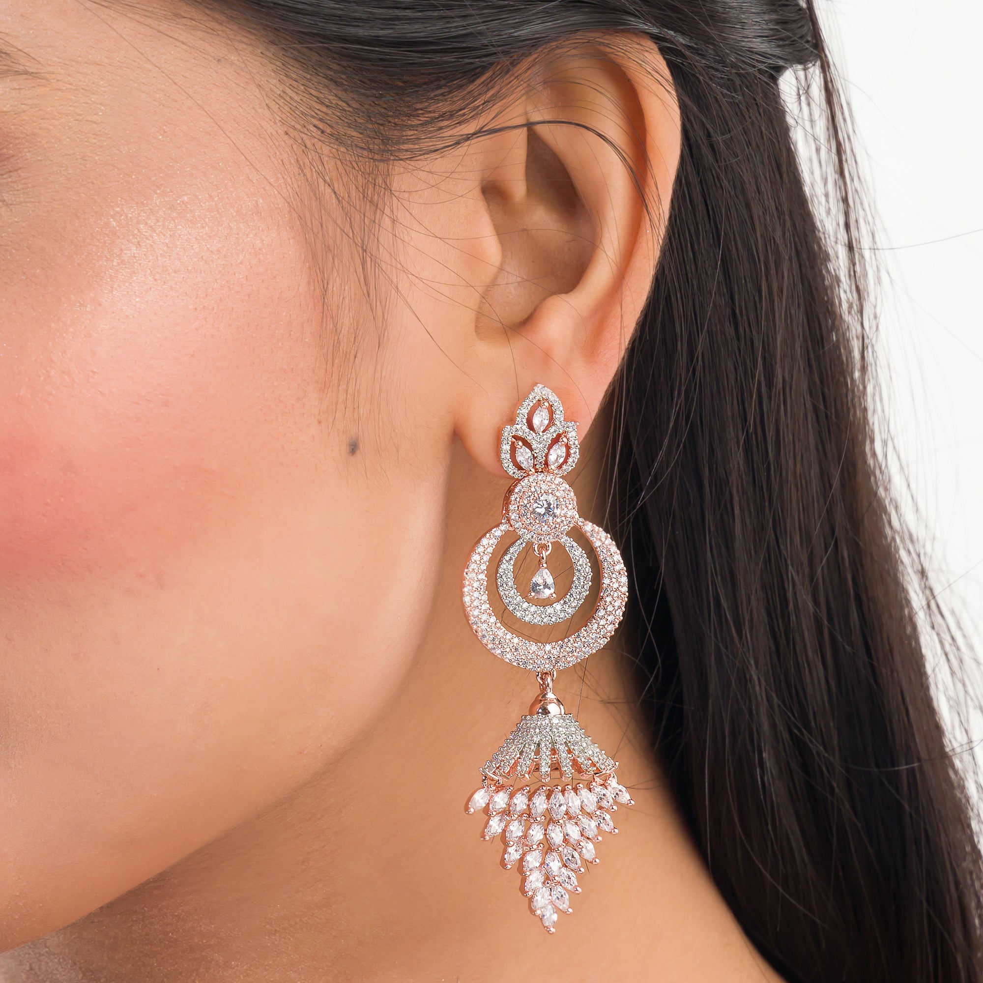 Sparkling zircon dangler earrings in rose gold, perfect for party elegance.