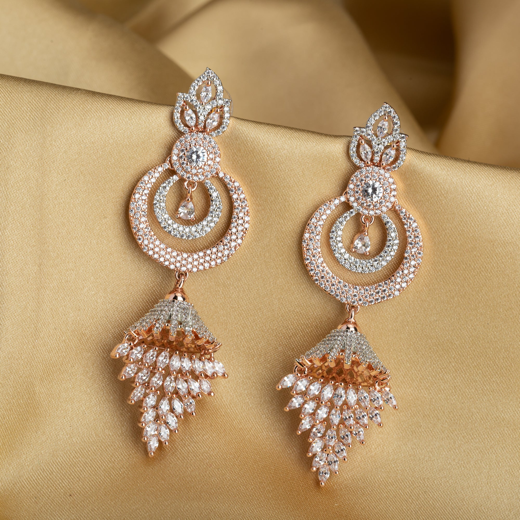 Sparkling zircon dangler earrings in rose gold, perfect for party elegance.