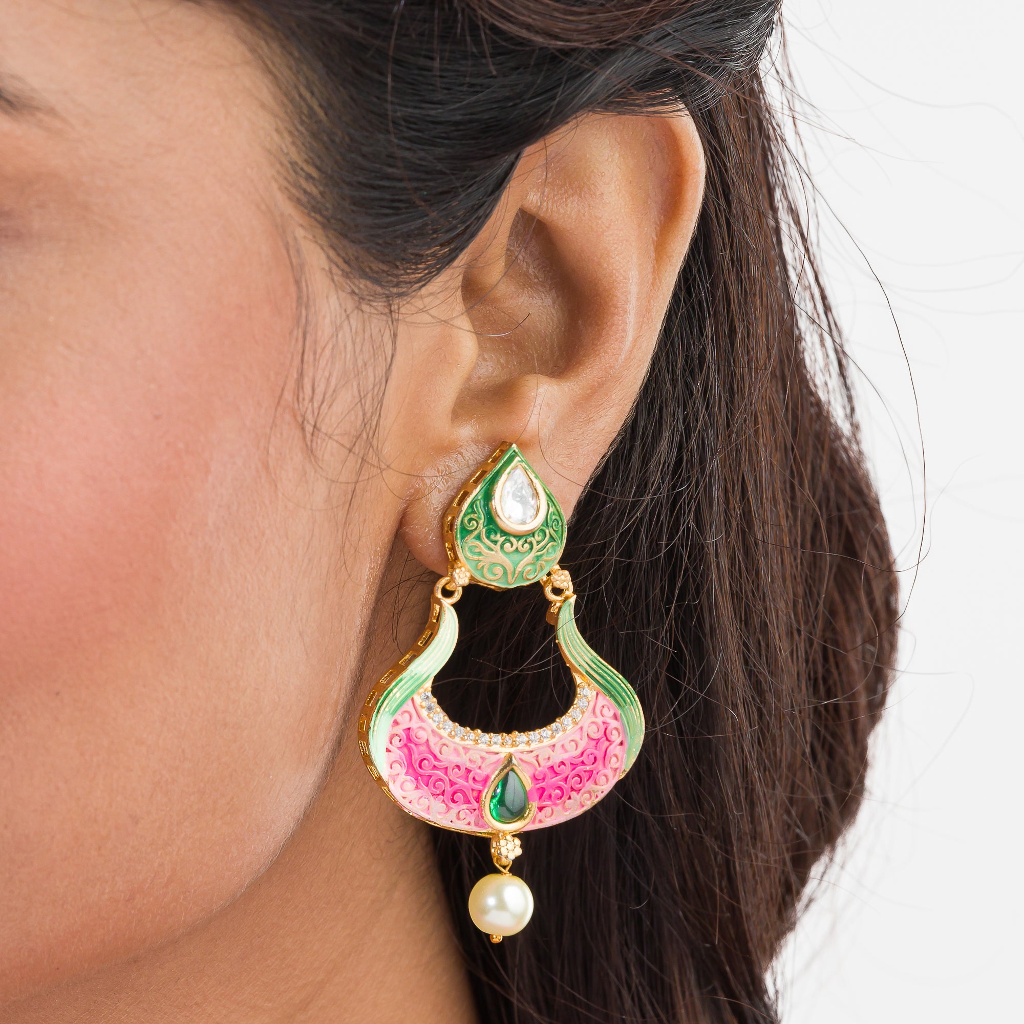 Gold-tone dangler earrings with Meenakari design offer intricate elegance and charm.