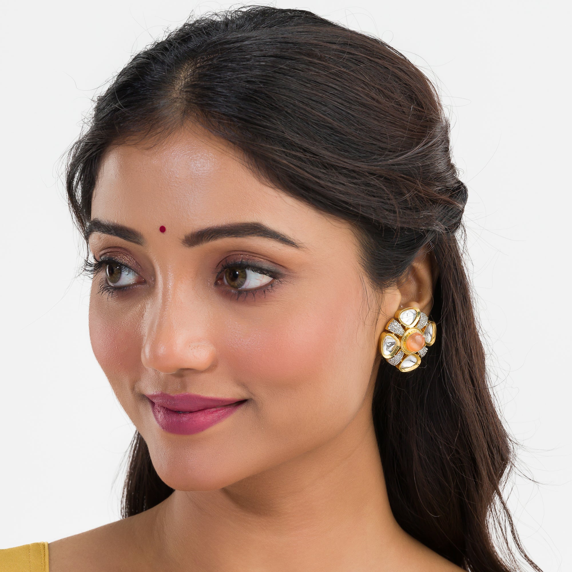 Orange zircon stud earrings with white accents, offering a pop of color and sparkle.