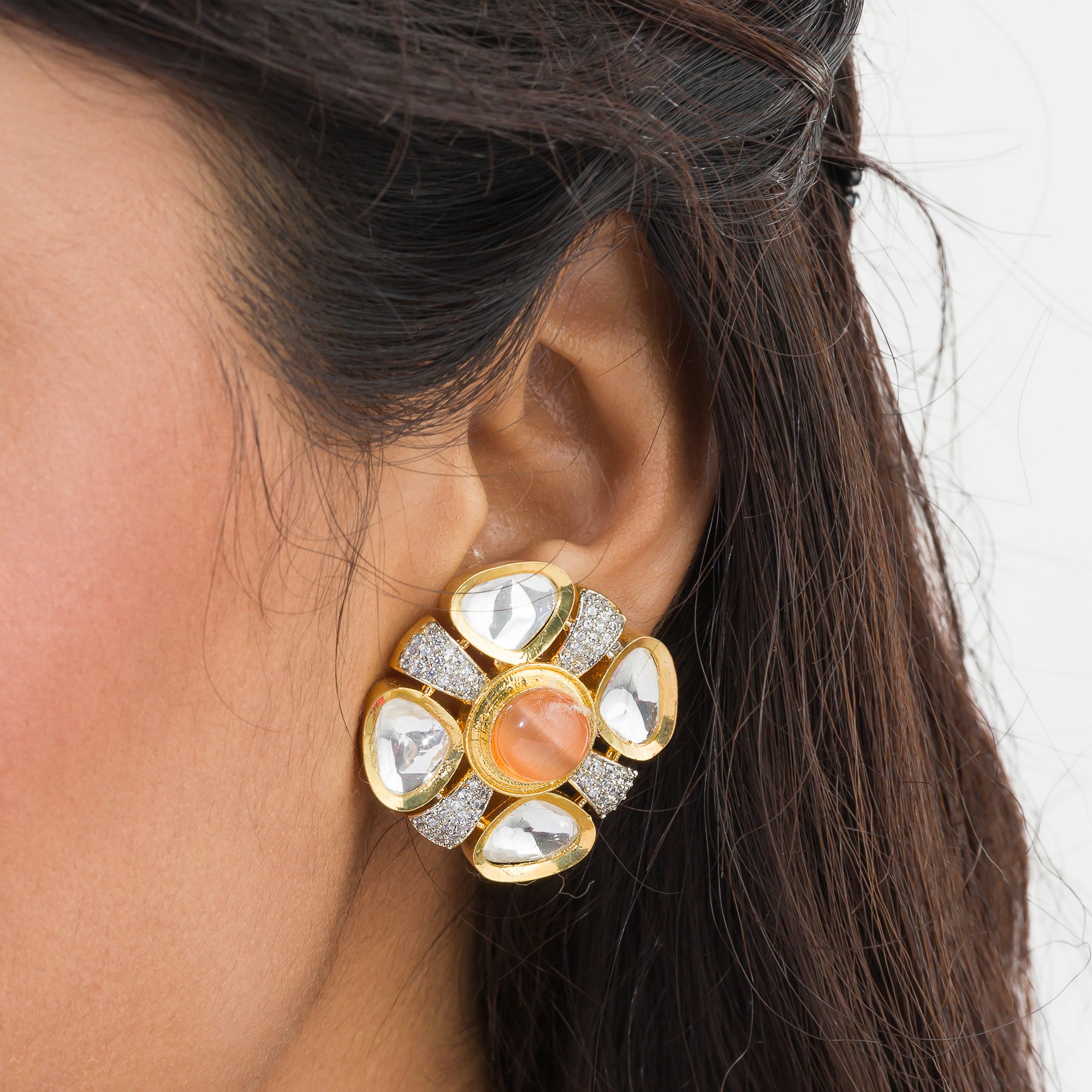 Orange zircon stud earrings with white accents, offering a pop of color and sparkle.