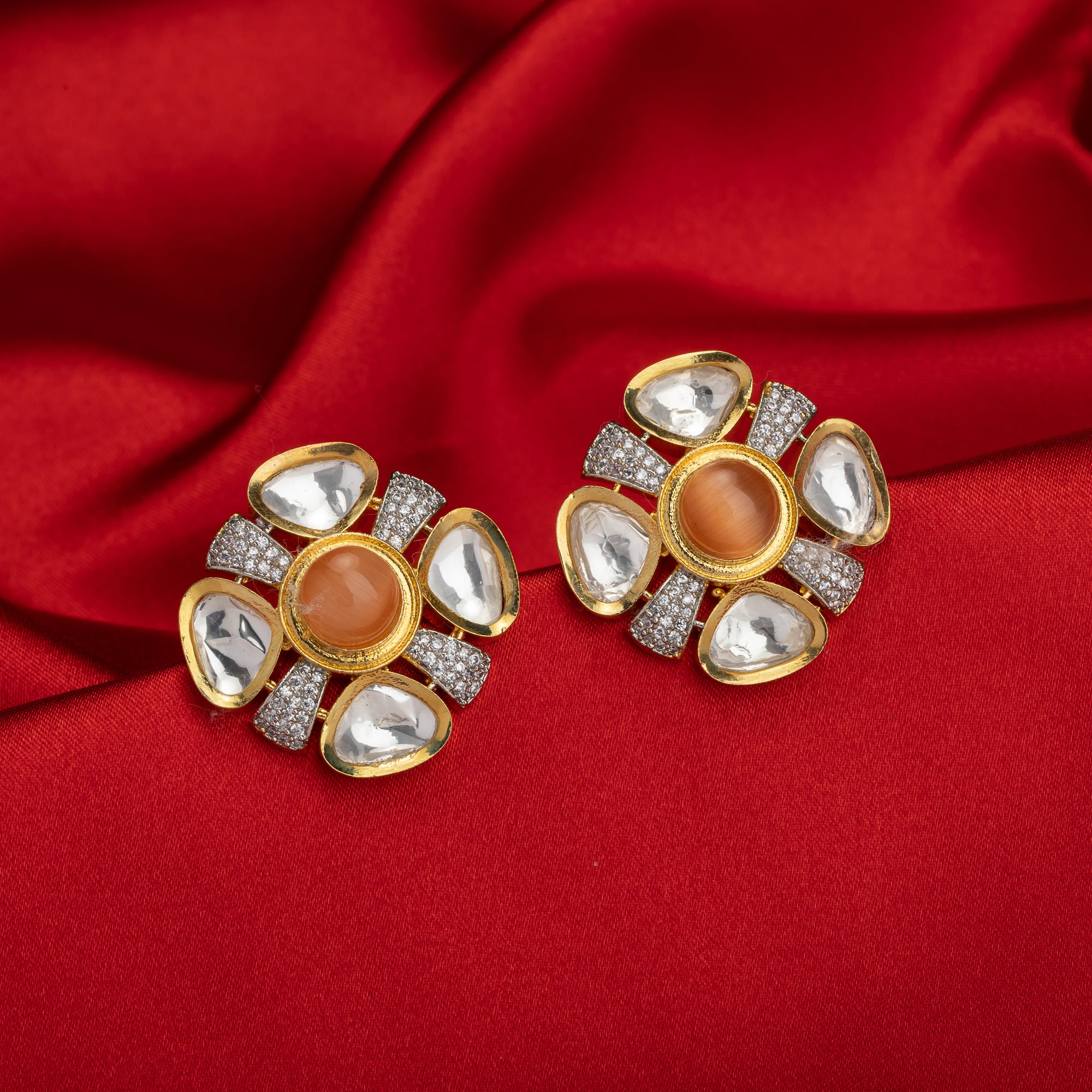 Orange zircon stud earrings with white accents, offering a pop of color and sparkle.
