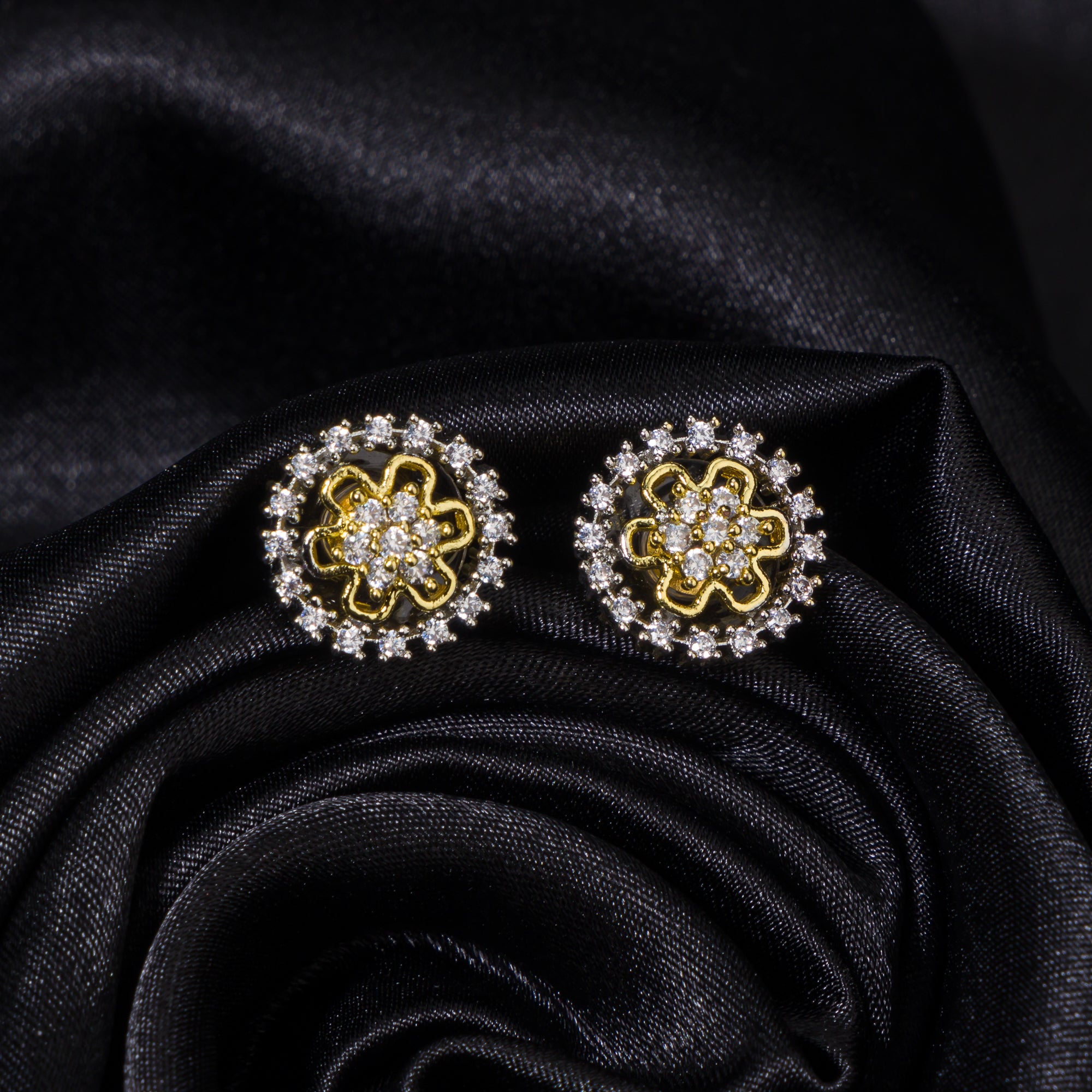 "Zircon studs with gold polish offer timeless sparkle and a luxurious touch for casual occasions."