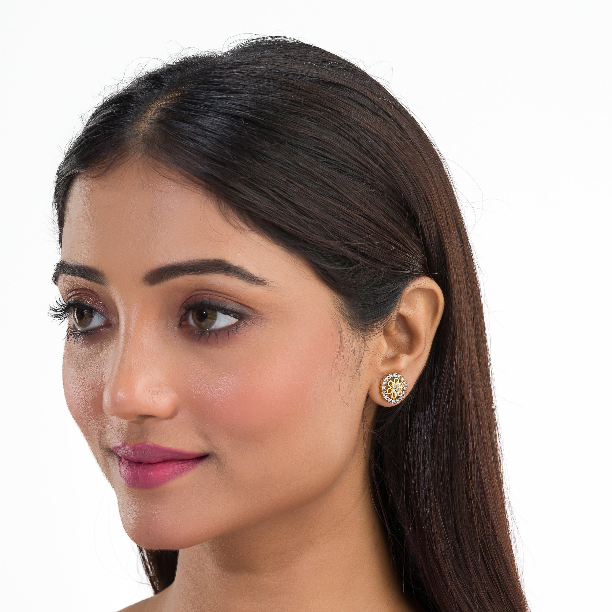 "Zircon studs with gold polish offer timeless sparkle and a luxurious touch for casual occasions."