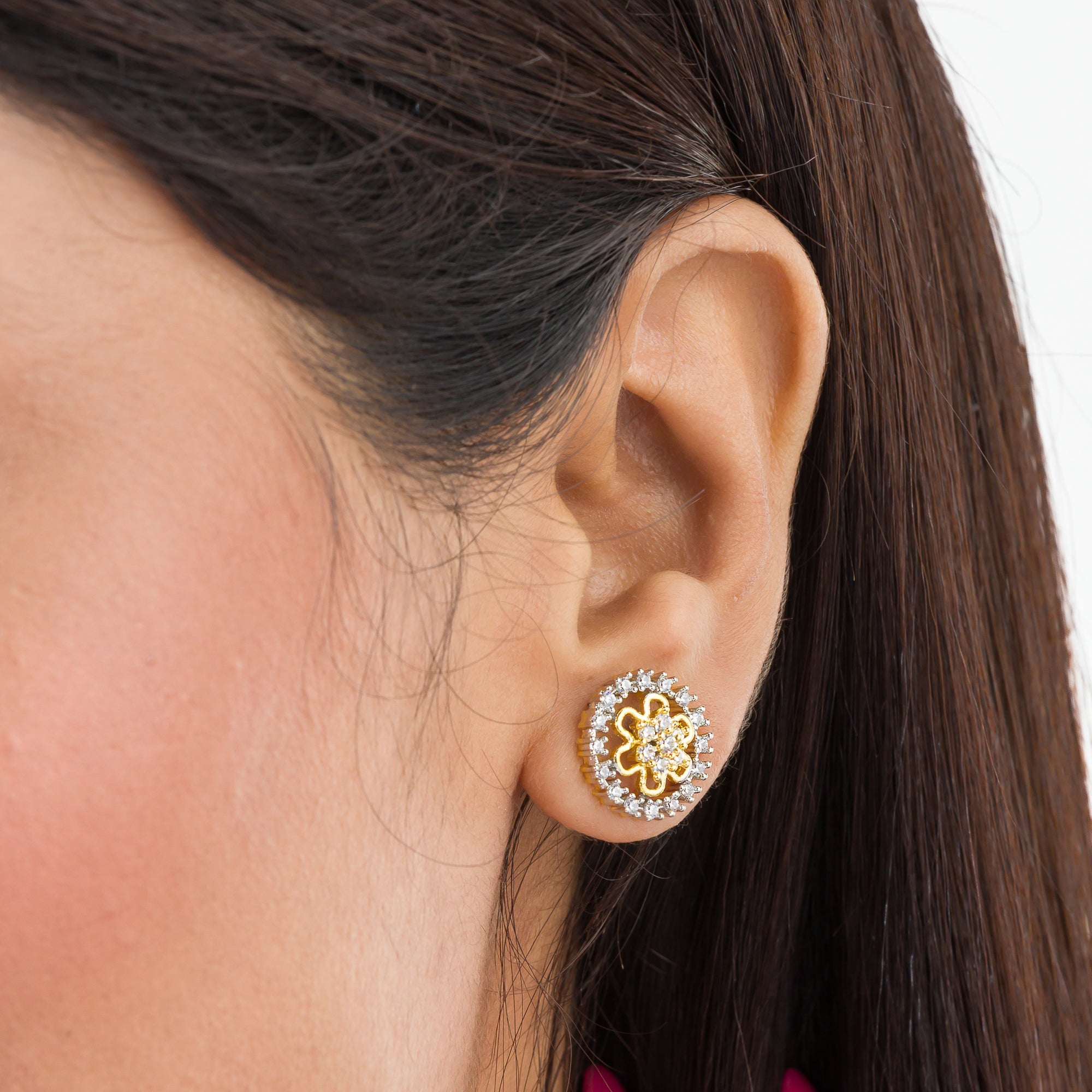 "Zircon studs with gold polish offer timeless sparkle and a luxurious touch for casual occasions."