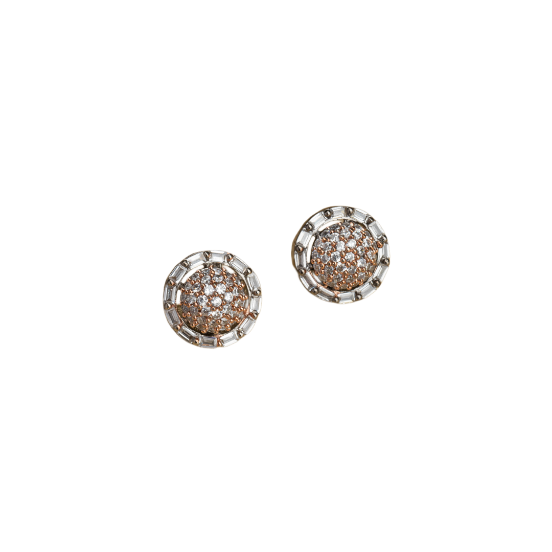 "Silver zircon studs with golden beads bring a subtle, stylish touch to casual elegance."