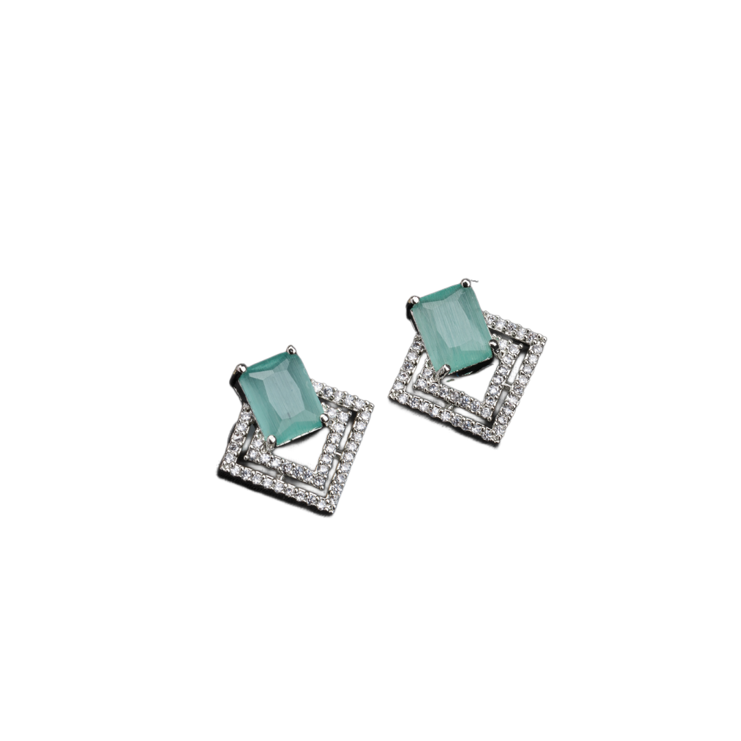 "Light green zircon studs sparkle with elegance, adding vibrant color to your casual look."