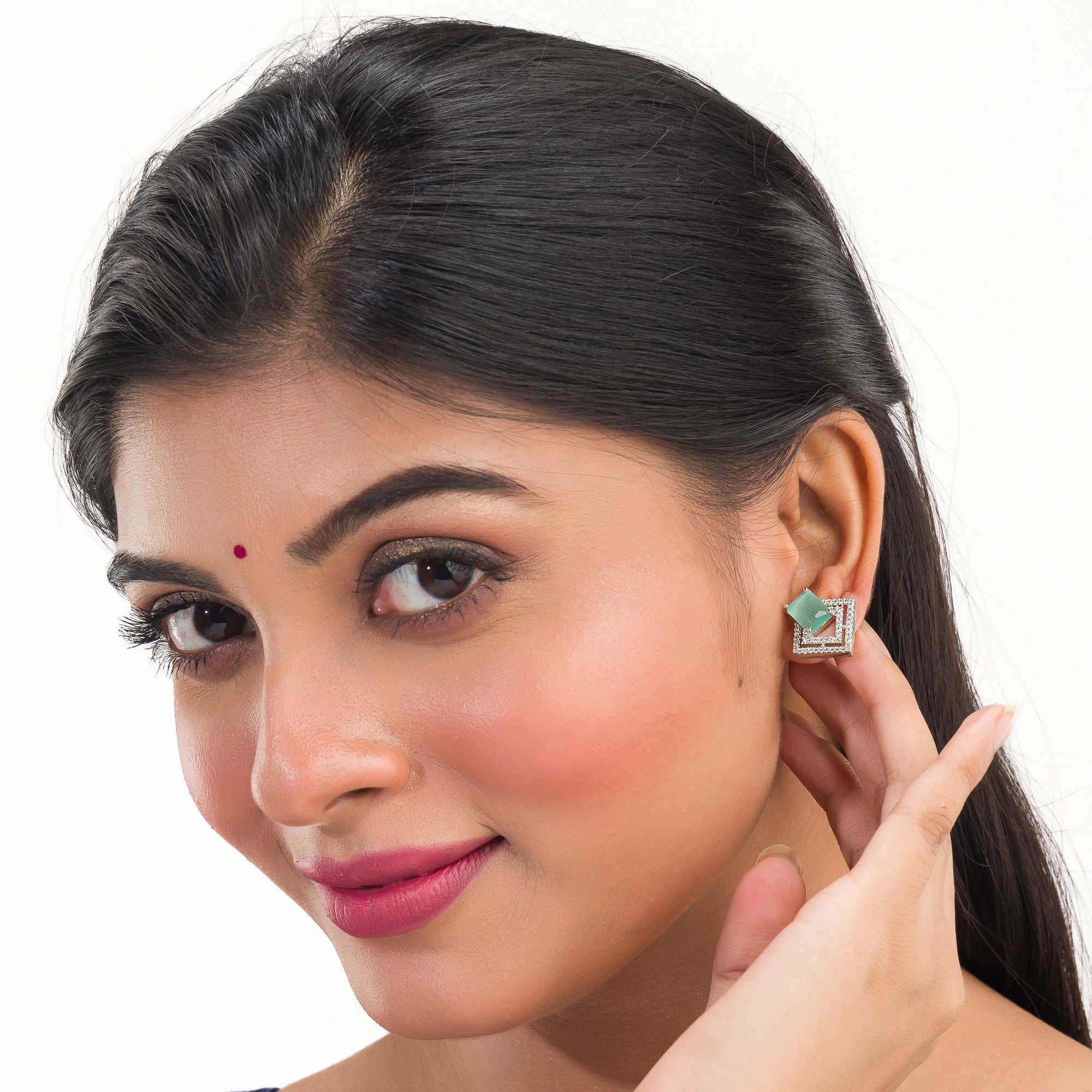 "Light green zircon studs sparkle with elegance, adding vibrant color to your casual look."