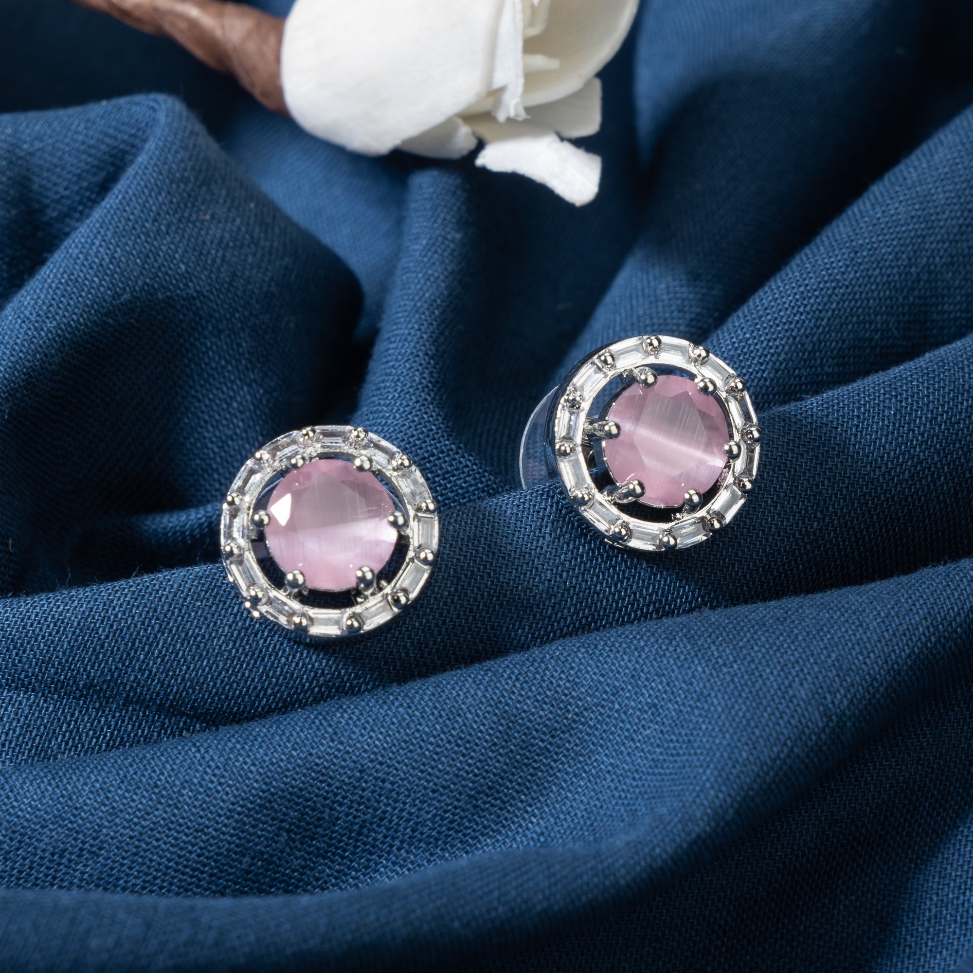 "Pink zircon stud earrings bring stunning sparkle and a vibrant, elegant touch to any look."