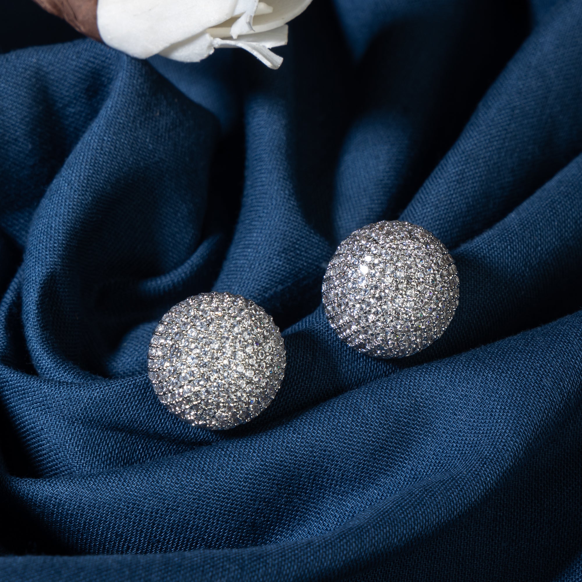 "Timeless zircon stud earrings with brilliant sparkle add versatile elegance to any outfit."