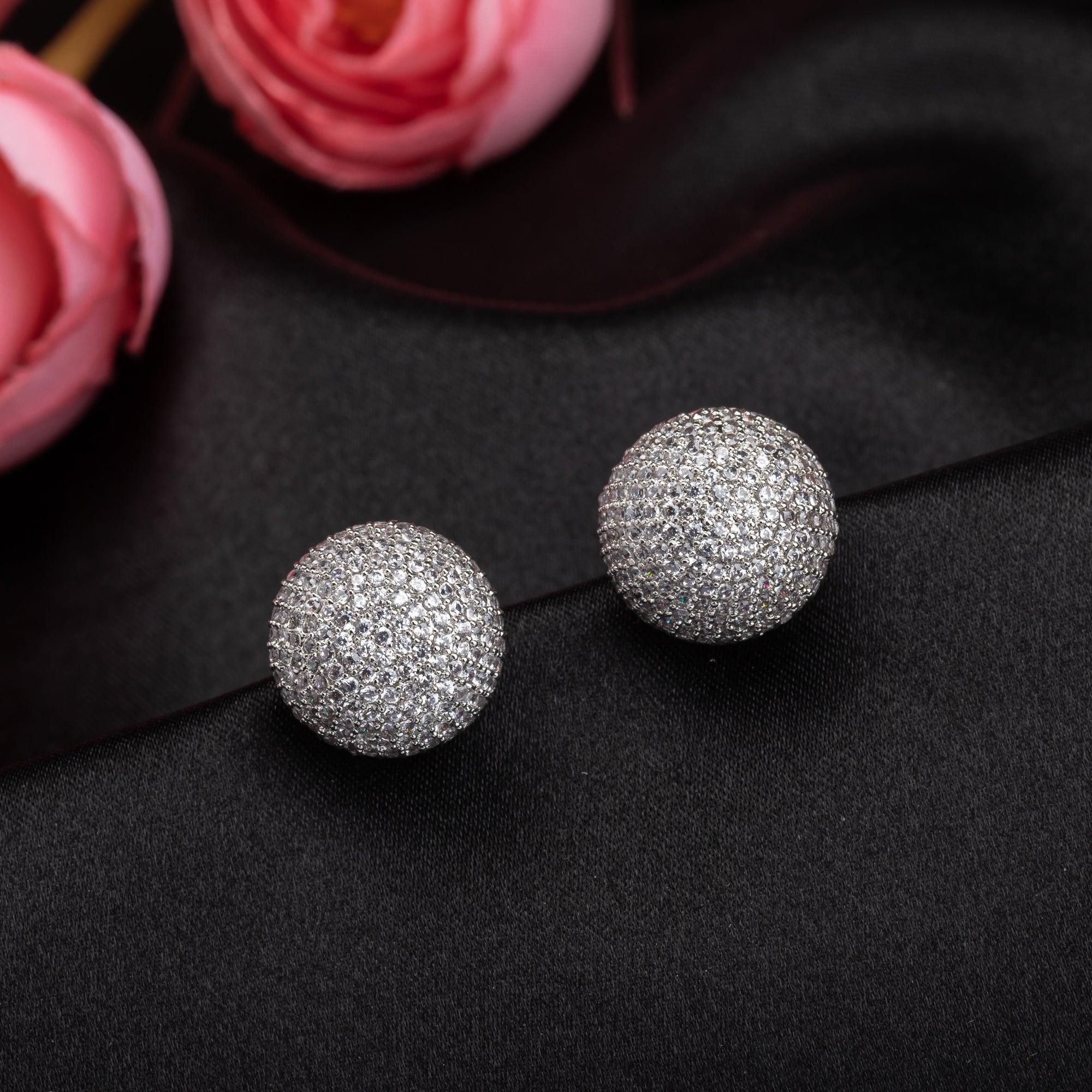"Timeless zircon stud earrings with brilliant sparkle add versatile elegance to any outfit."
