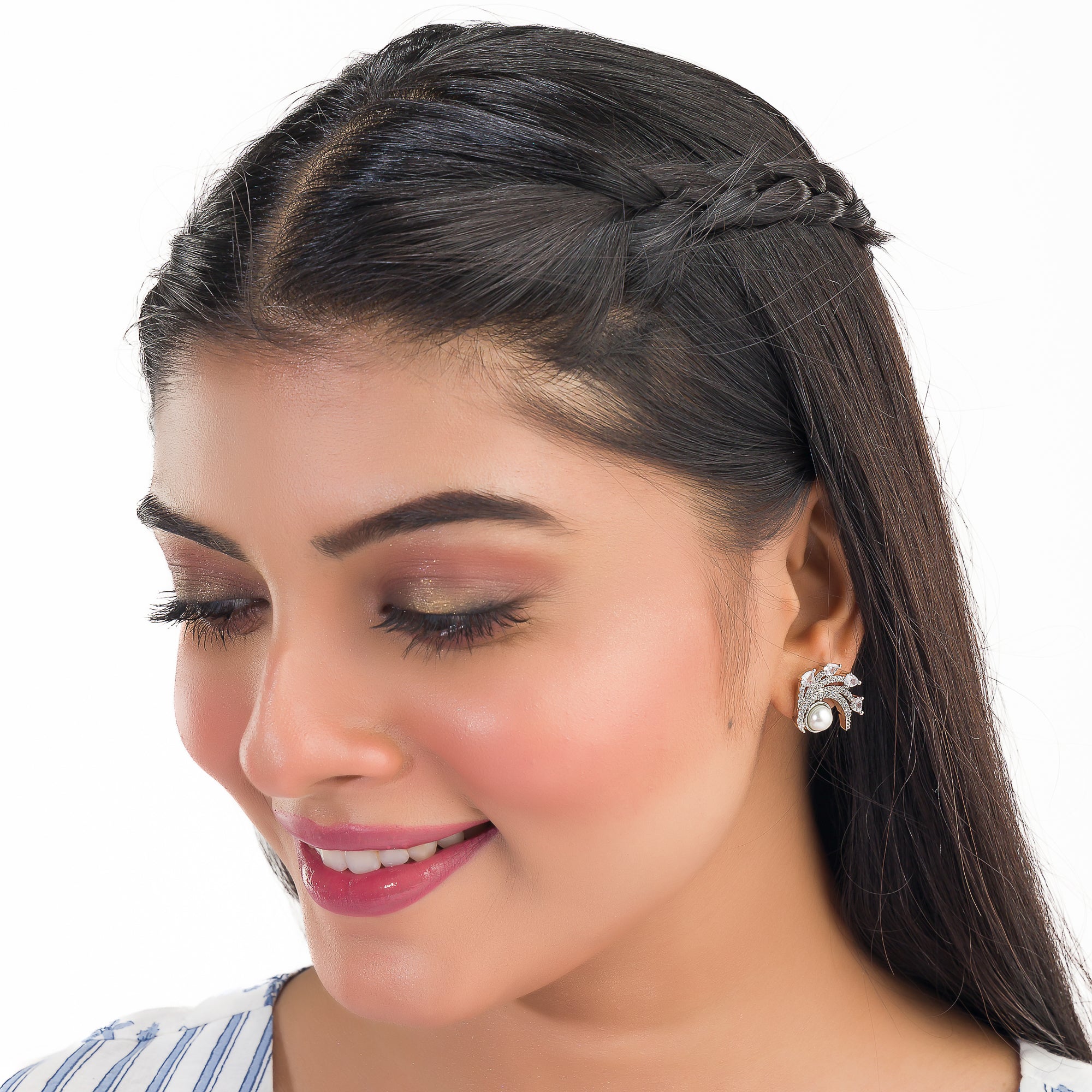 "Zircon studs with a single pearl offer sparkling brilliance and classic, sophisticated elegance."