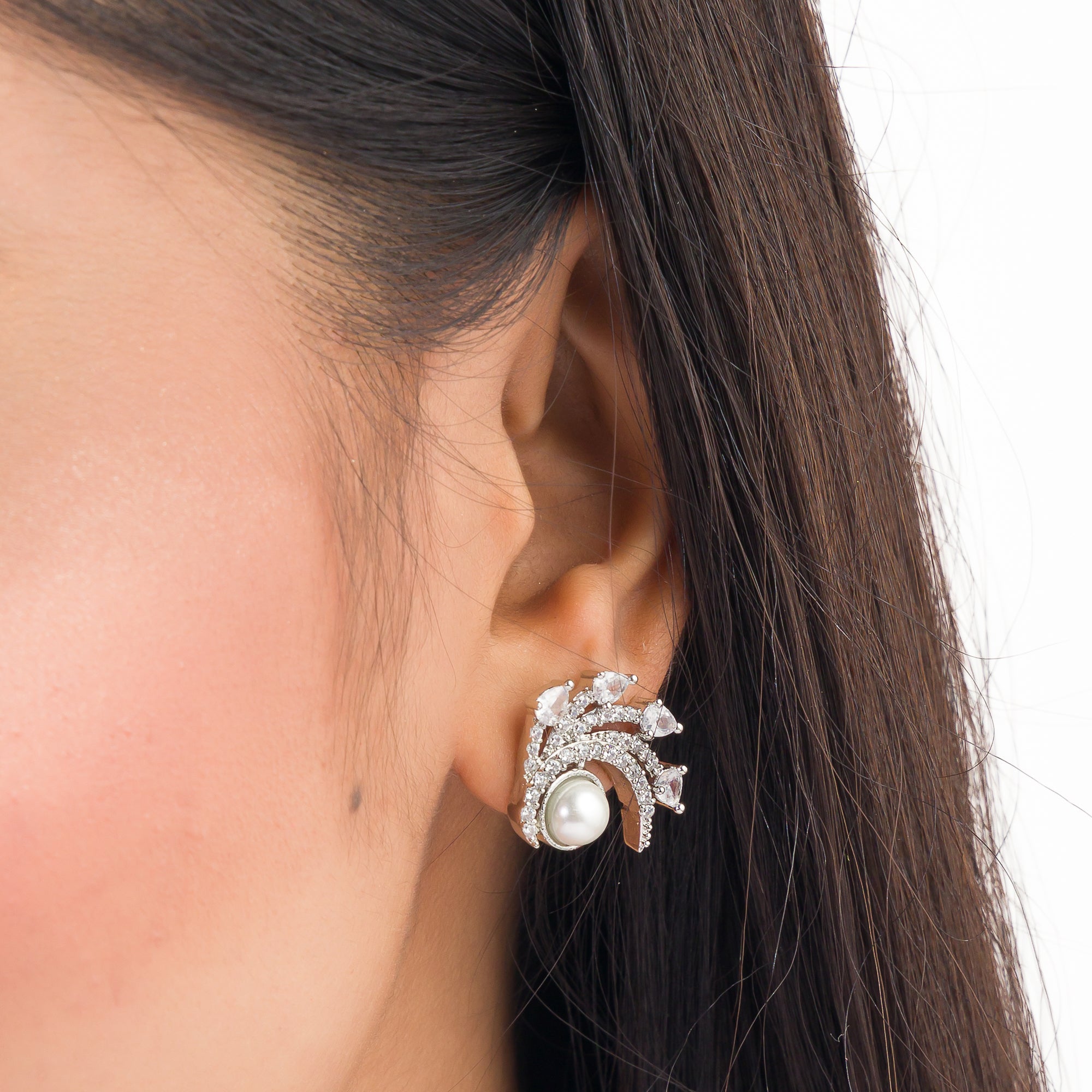 "Zircon studs with a single pearl offer sparkling brilliance and classic, sophisticated elegance."