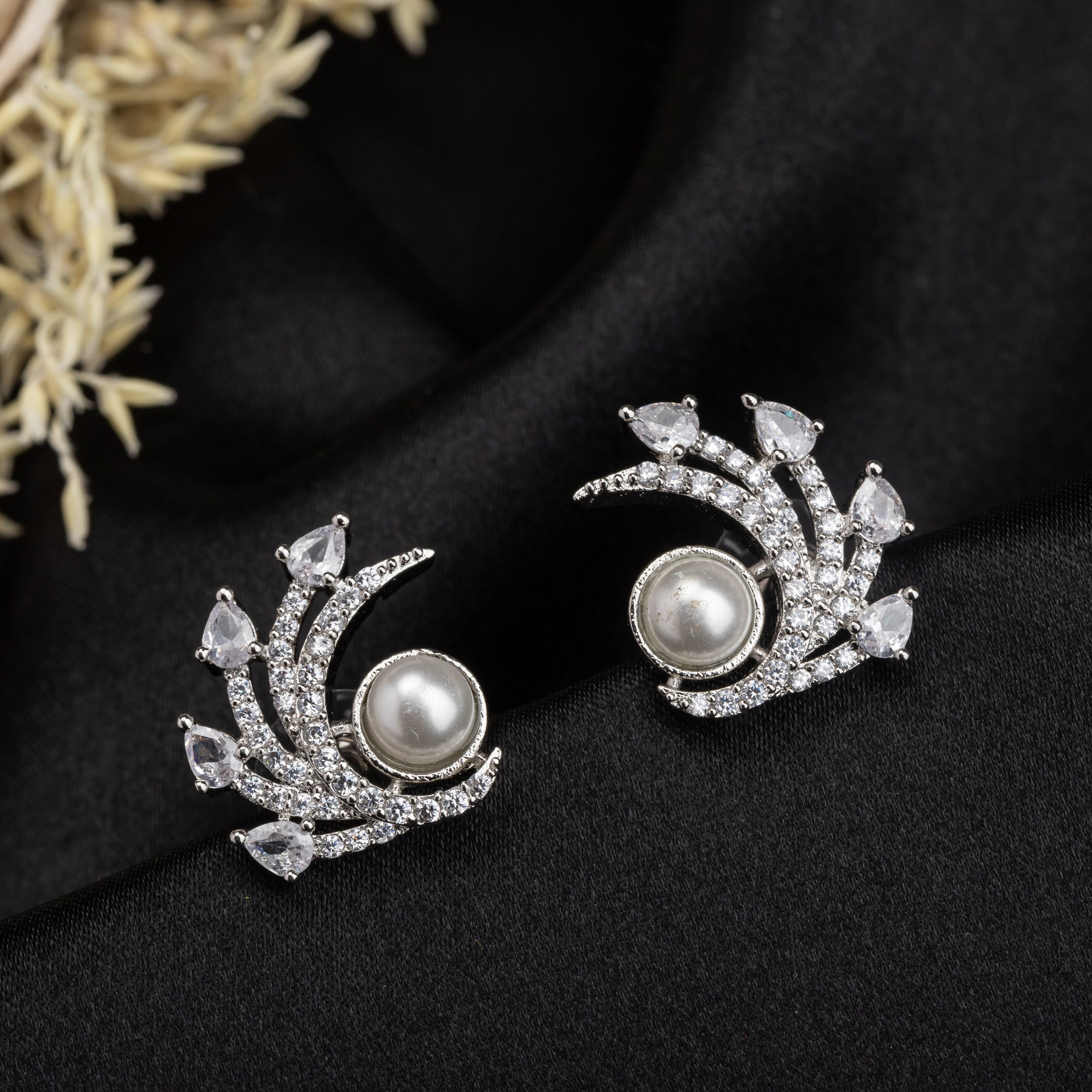 "Zircon studs with a single pearl offer sparkling brilliance and classic, sophisticated elegance."