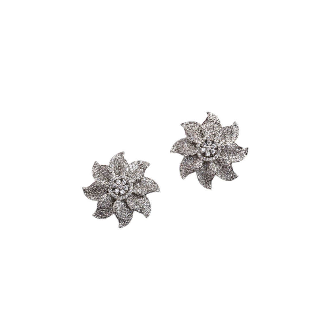 Flowery zircon stud earrings offer charming elegance with sparkling grace for a refined look.