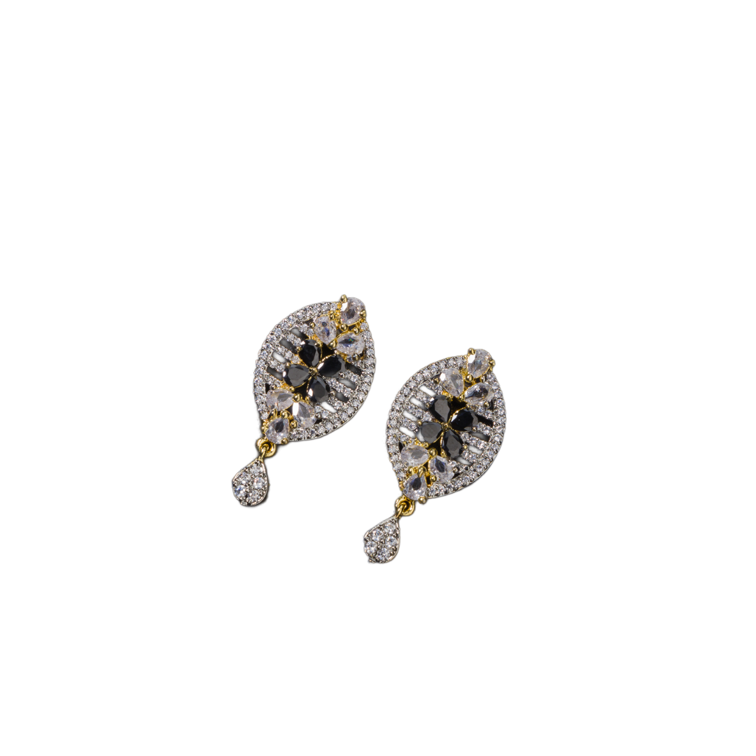 "Zircon earrings with a golden touch combine sparkling brilliance and a warm, luxurious finish."