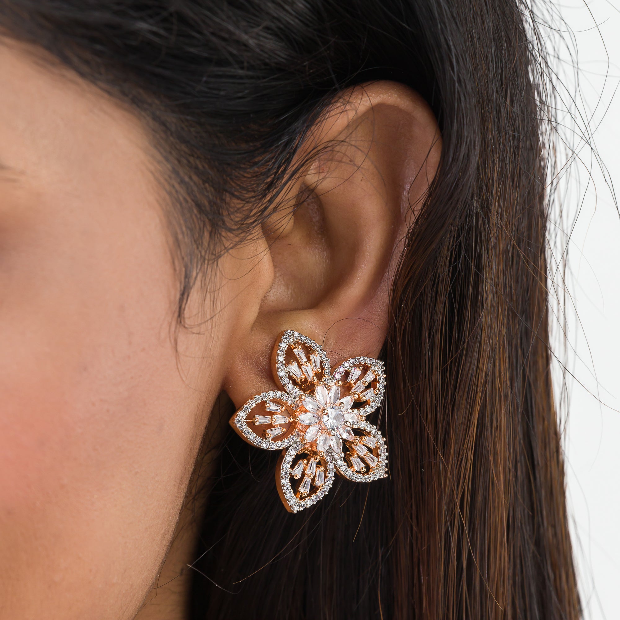 "Rose gold zircon earrings with sparkling brilliance for a sophisticated touch."