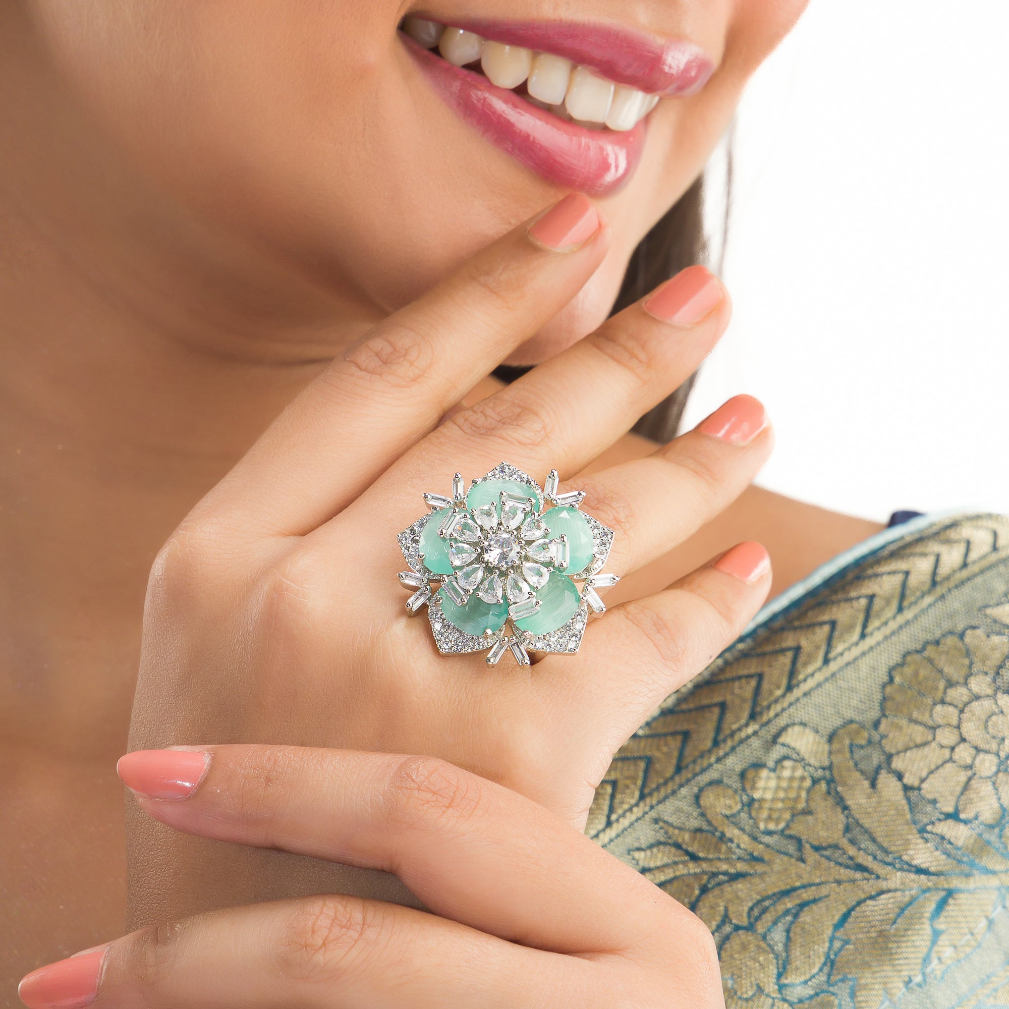 Silver zircon finger ring with turquoise stone offers vibrant charm and sparkling brilliance.