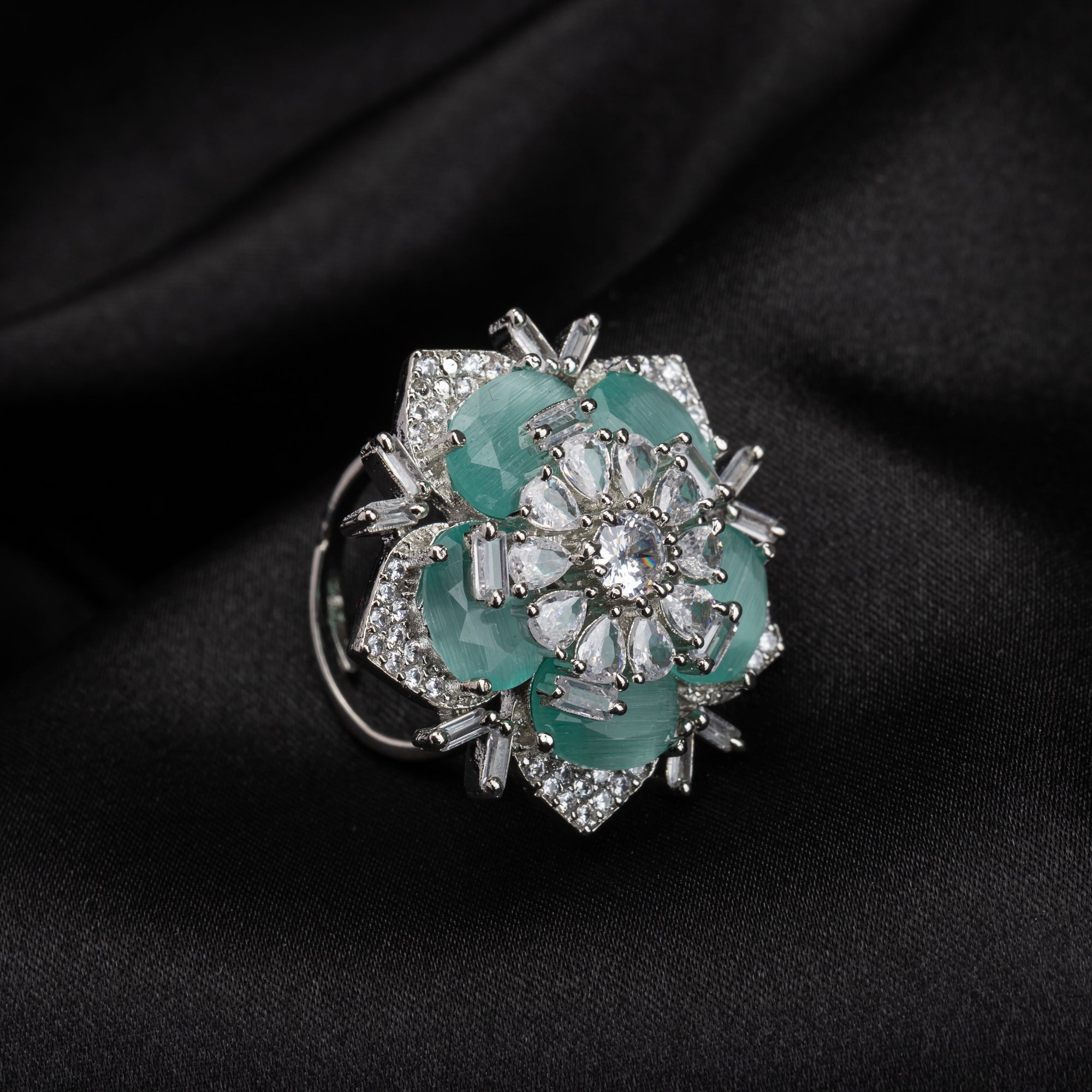Silver zircon finger ring with turquoise stone offers vibrant charm and sparkling brilliance.