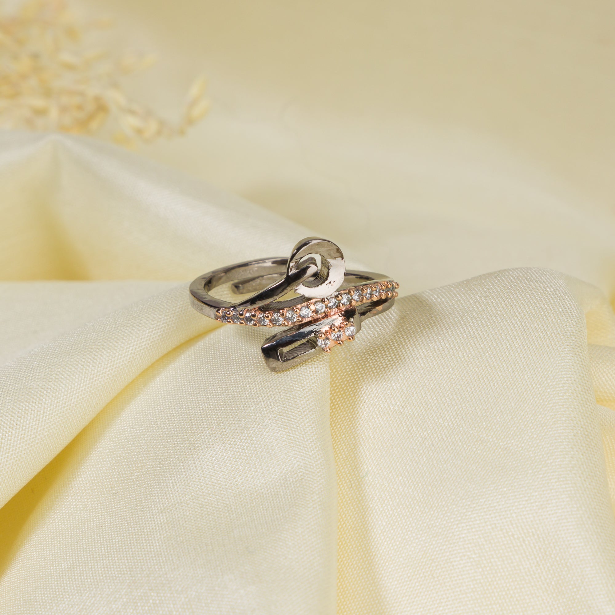 The gold-tone zircon finger ring adds a subtle yet sophisticated sparkle to any outfit.
