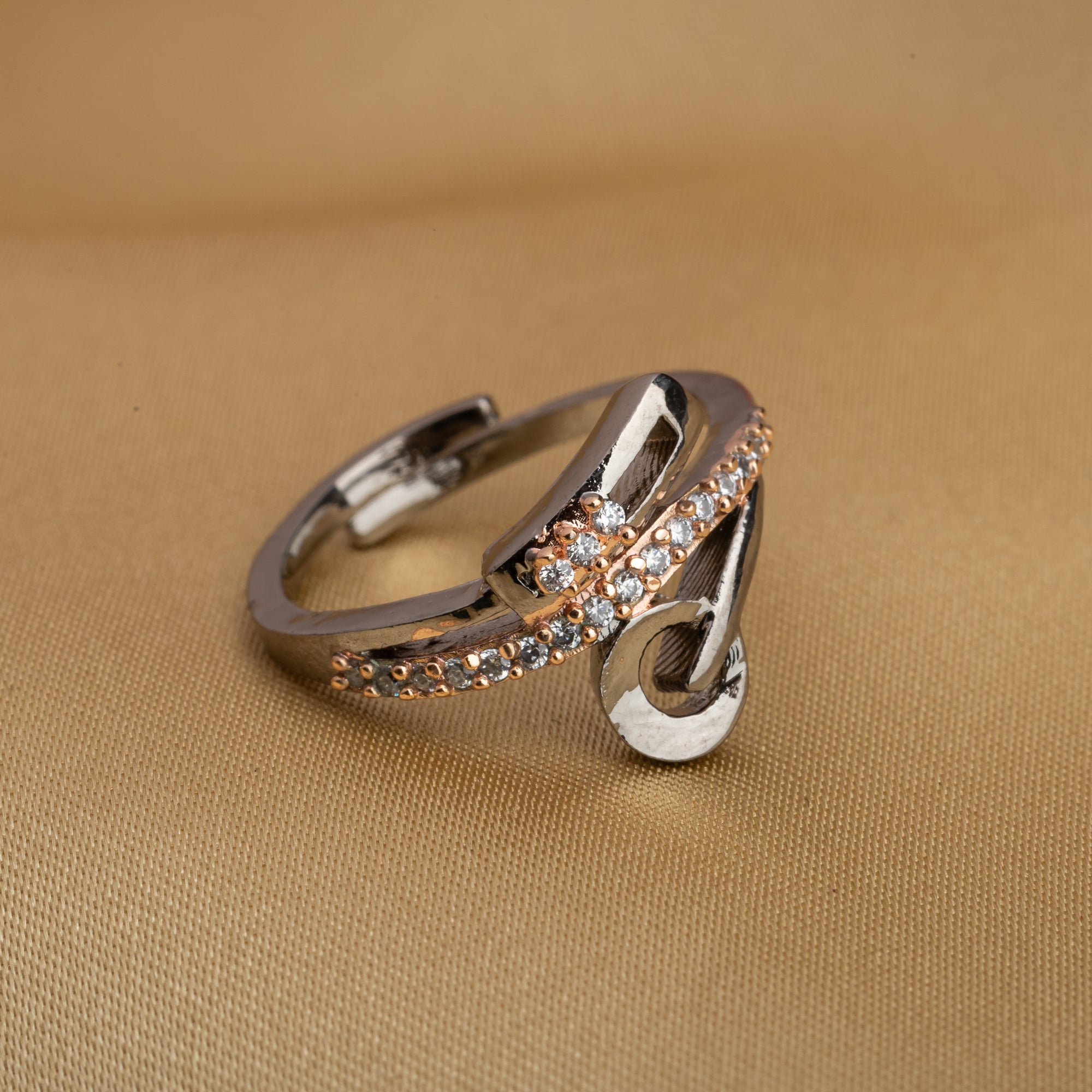 The gold-tone zircon finger ring adds a subtle yet sophisticated sparkle to any outfit.