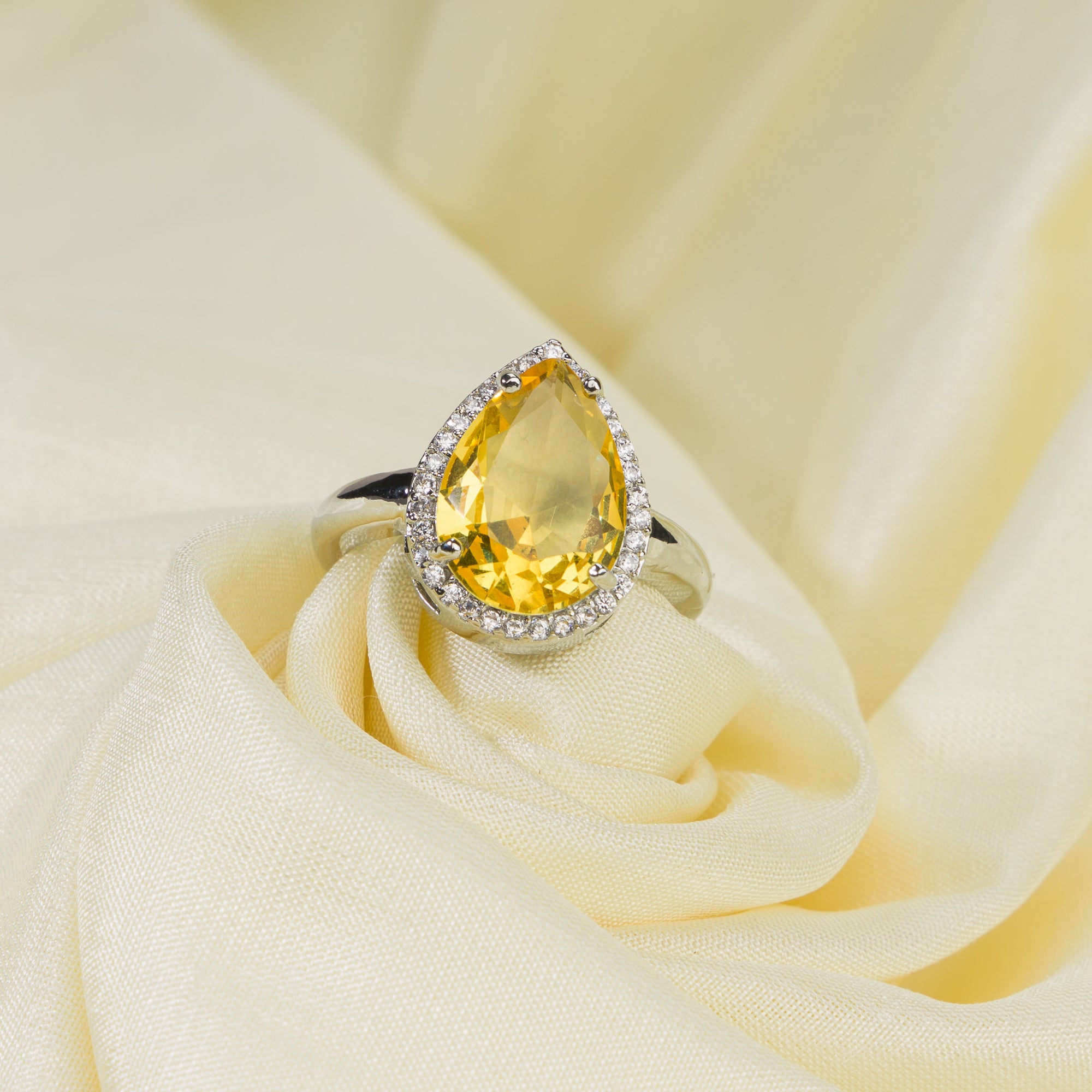 Zircon finger ring with yellow stone provides a bright and cheerful sparkle for casual wear.
