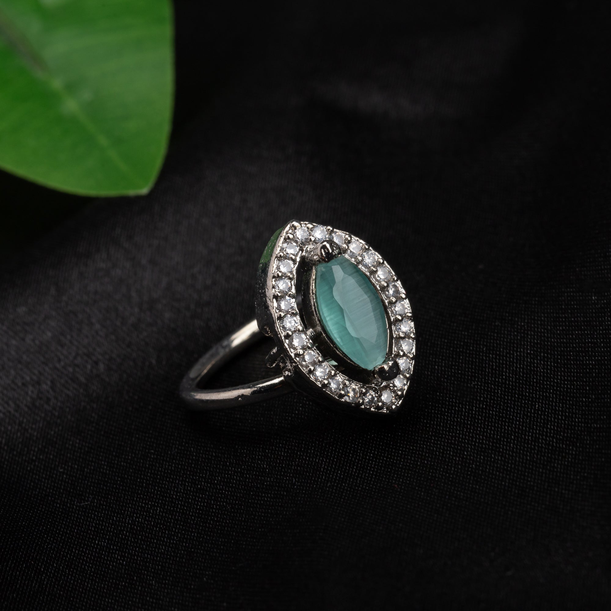 Zircon finger ring with turquoise stone adds a serene and chic sparkle for any occasion.