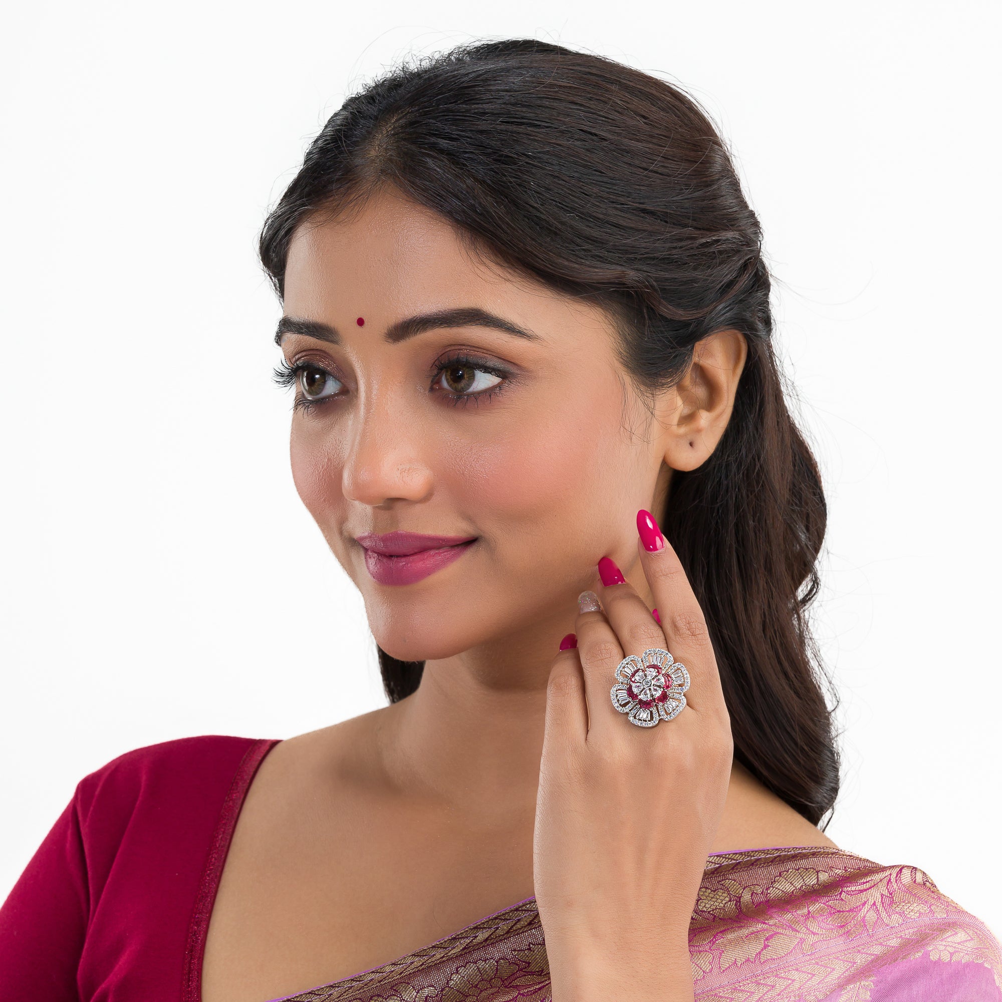 Red zircon finger ring in silver offers a bold and vibrant touch for party occasions.