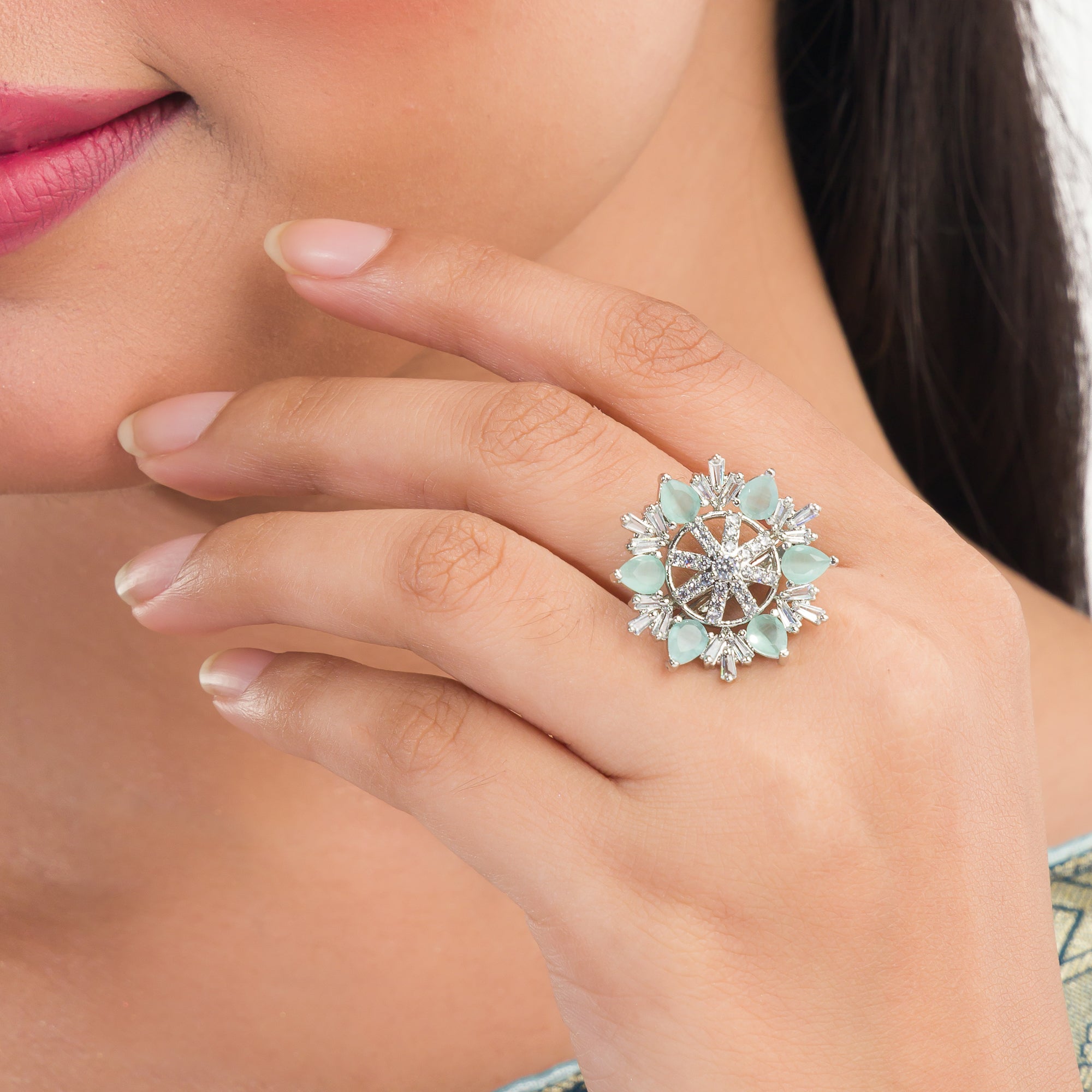 Aqua floral zircon finger ring adds a serene and vibrant charm to your party look.